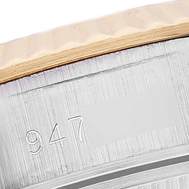 The image shows a close-up of the serial number engraving and bezel of a Rolex Datejust 69173 Women's Steel and Gold (two tone) Champagne Dial 69173 Women's Steel and Gold (two tone) Champagne Dial watch.