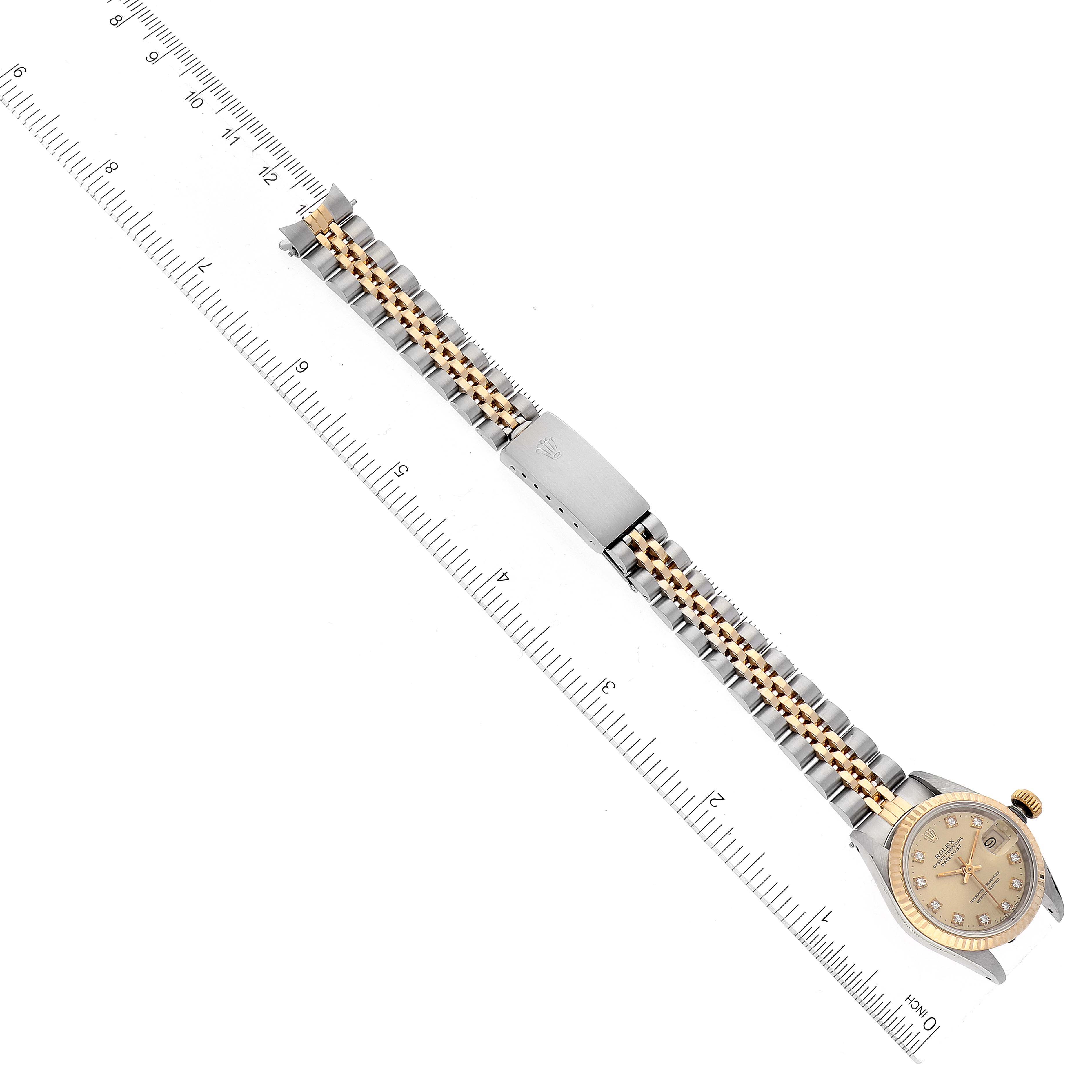 The image shows a Rolex Datejust 69173 Women's Steel and Gold (two tone) Champagne Dial 69173 Women's Steel and Gold (two tone) Champagne Dial watch laid flat, showing the full length of the band next to a ruler for scale.