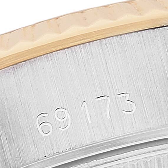 This close-up image shows the side of the bezel and the serial number of the Rolex Datejust 69173 Women's Steel and Gold (two tone) Champagne Dial 69173 Women's Steel and Gold (two tone) Champagne Dial model 69173.