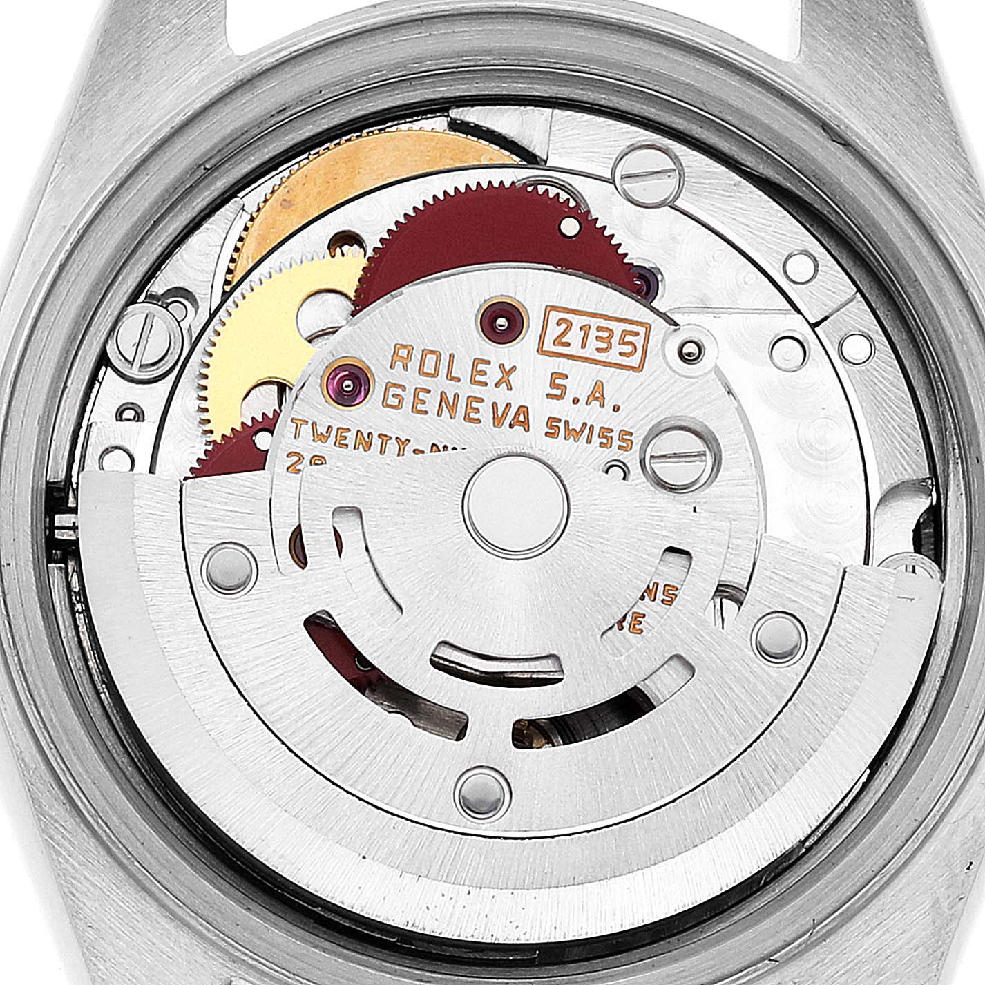The image shows the internal mechanism of a Rolex Datejust 69173 Women's Steel and Gold (two tone) Champagne Dial 69173 Women's Steel and Gold (two tone) Champagne Dial watch, highlighting gears and the 2135 movement.