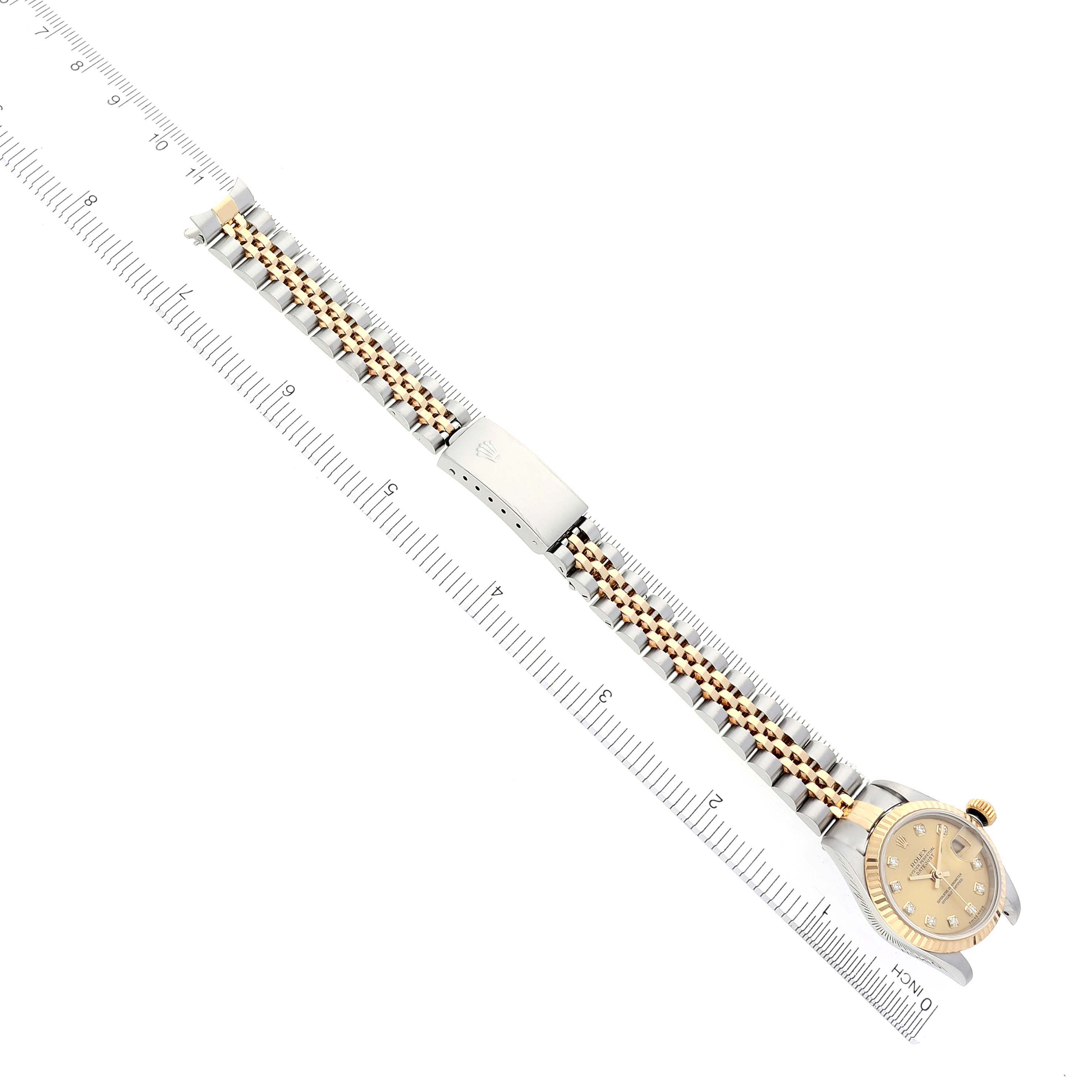 The Rolex Datejust 79173 Women
s Steel and Gold (two tone) Champagne Dial 79173 Women
s Steel and Gold (two tone) Champagne Dial watch is shown from a top-down angle, displaying the band, watch face, and clasp.