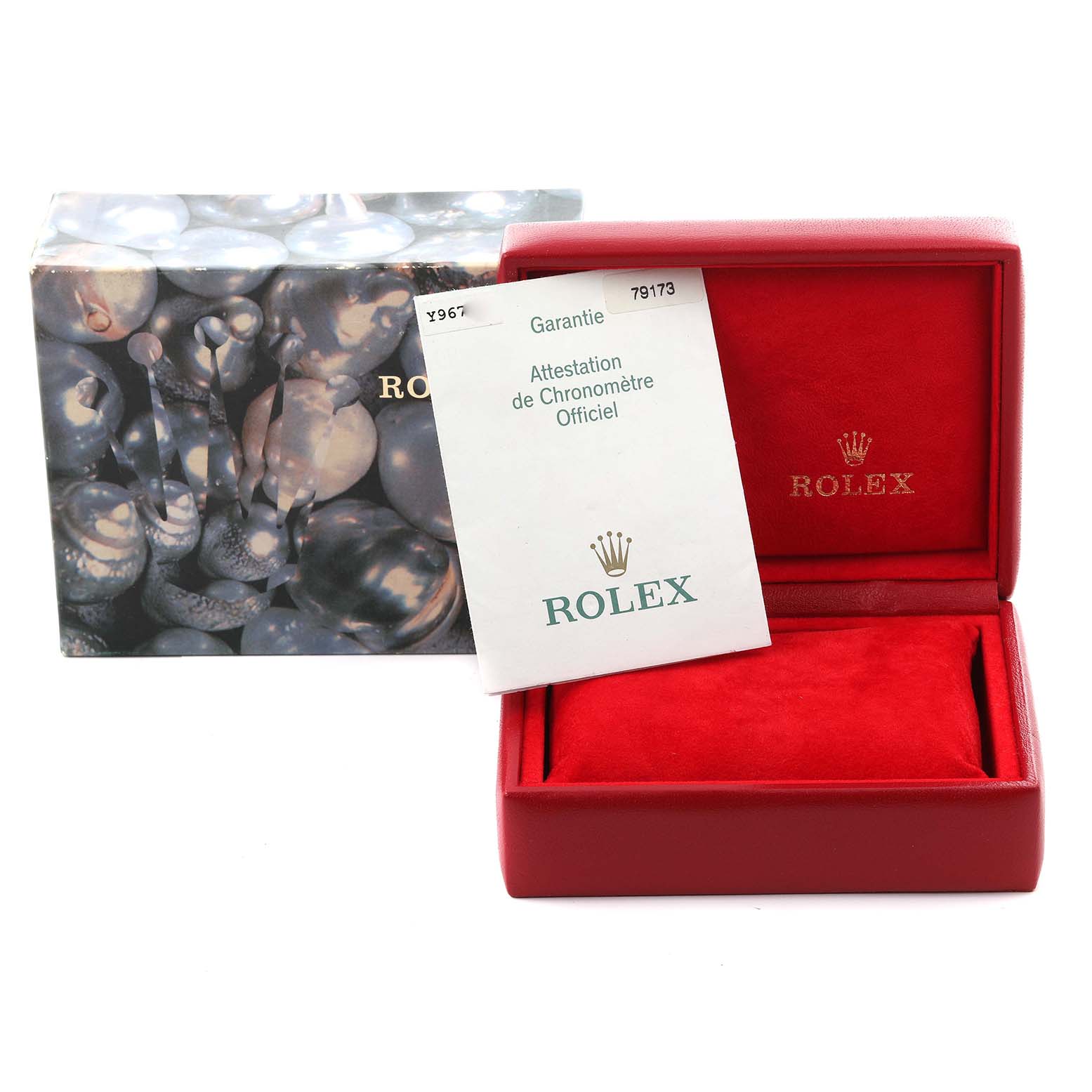 The image shows a Rolex Datejust 79173 Women
s Steel and Gold (two tone) Champagne Dial 79173 Women
s Steel and Gold (two tone) Champagne Dial watch box and a warranty card from a top-front angle.