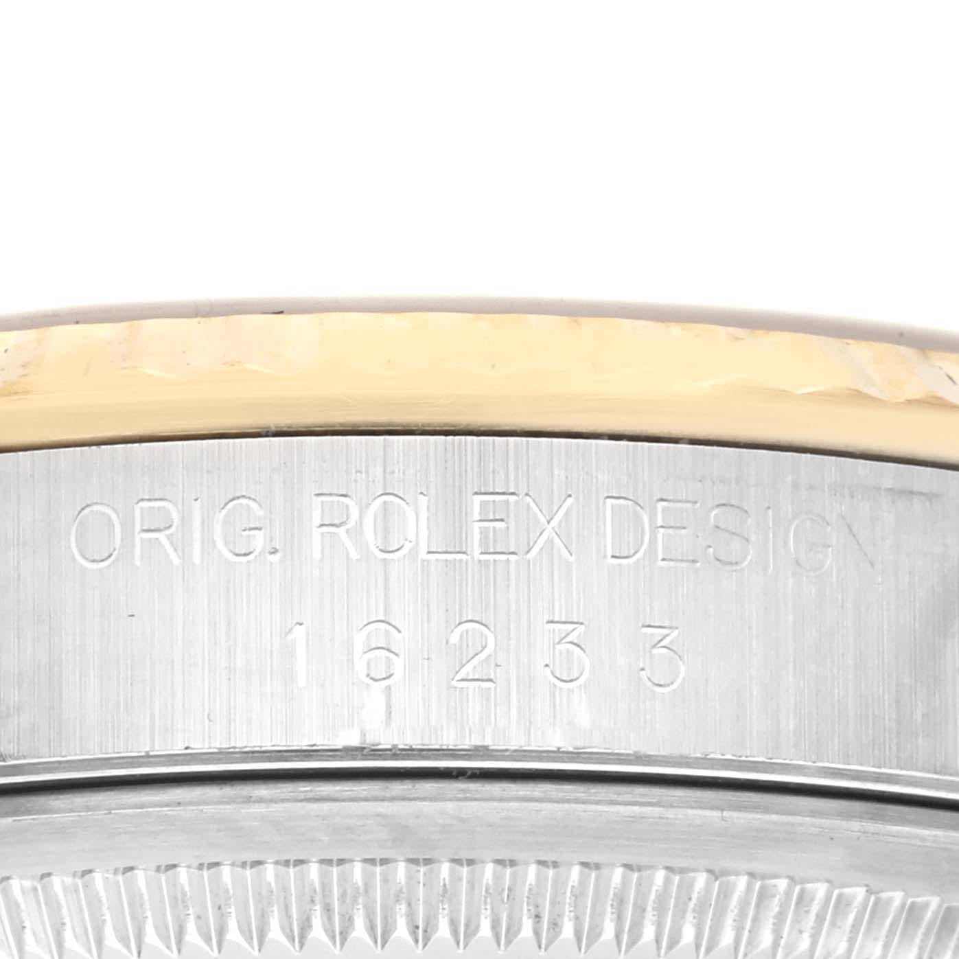 The image shows a close-up angle of the Rolex Datejust 16233 Men's Steel and Gold (two tone) Champagne Dial 16233 Men's Steel and Gold (two tone) Champagne Dial bezel and case, focusing on the engraved model number.