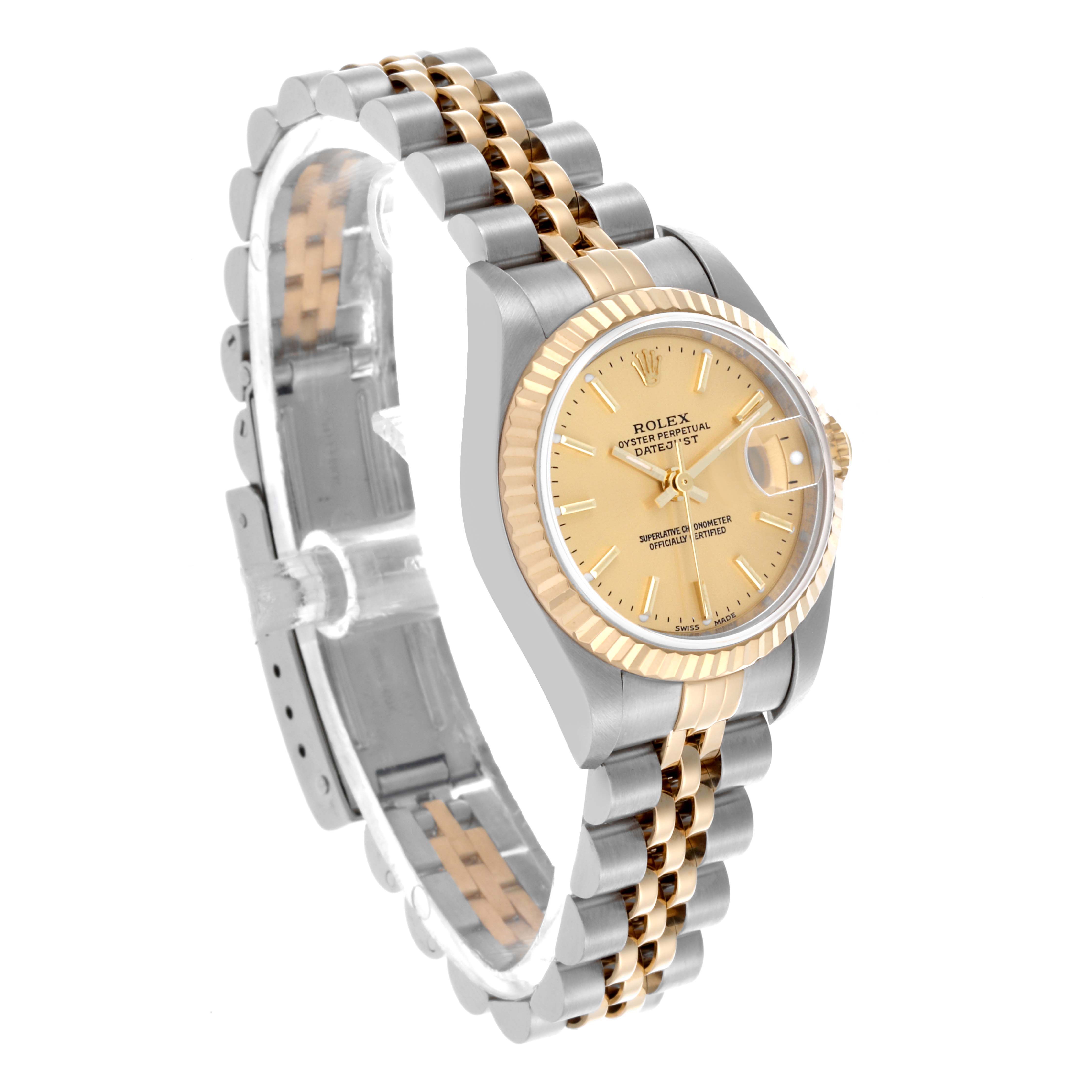 The Rolex Datejust 79173 Women
s Steel and Gold (two tone) Champagne Dial 79173 Women
s Steel and Gold (two tone) Champagne Dial watch is shown at a three-quarter angle, highlighting the face, fluted bezel, and Jubilee bracelet.