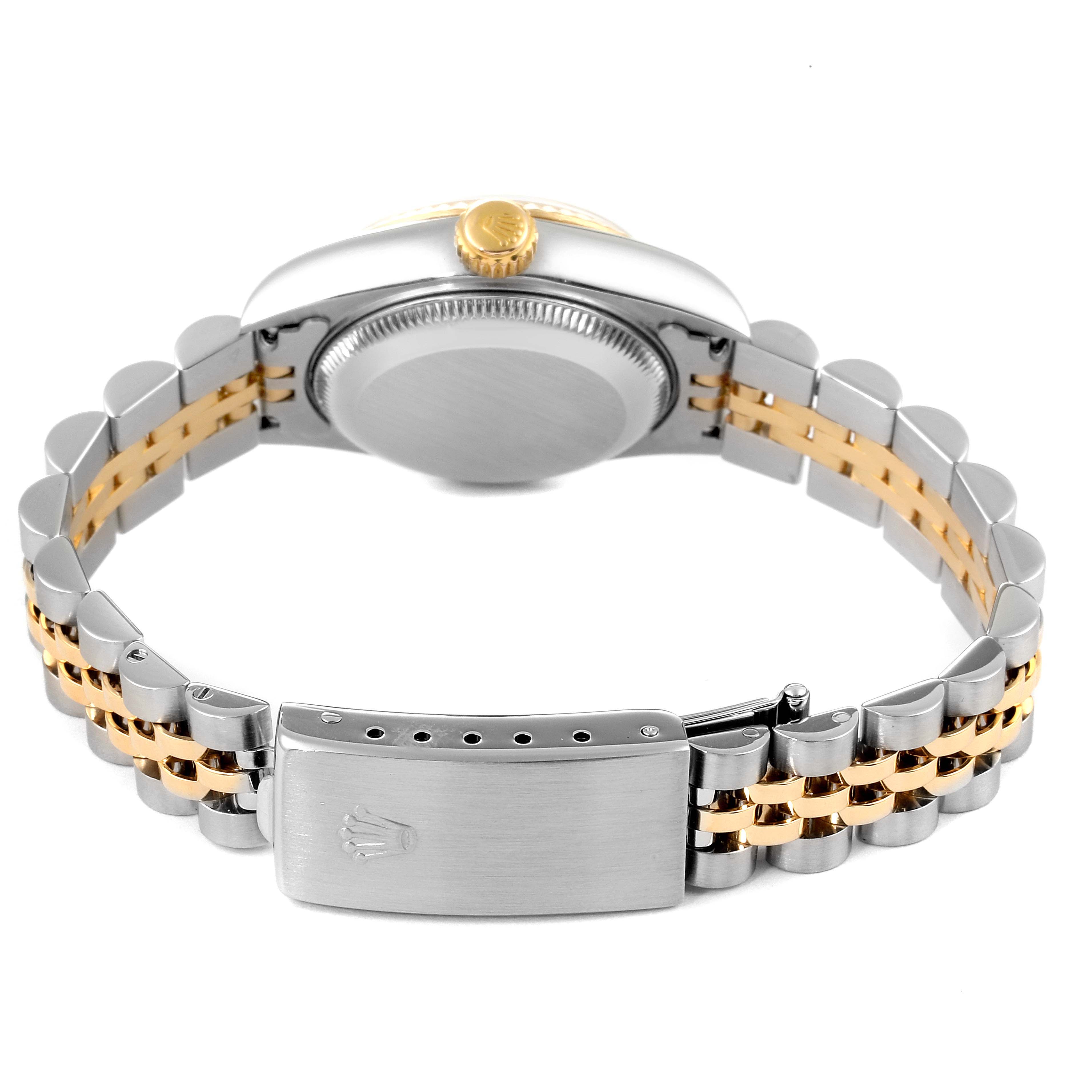 A Rolex Datejust 79173 Women
s Steel and Gold (two tone) Mother of Pearl Dial 79173 Women
s Steel and Gold (two tone) Mother of Pearl Dial watch is shown from the back, highlighting its two-tone bracelet, clasp, case back, and crown.