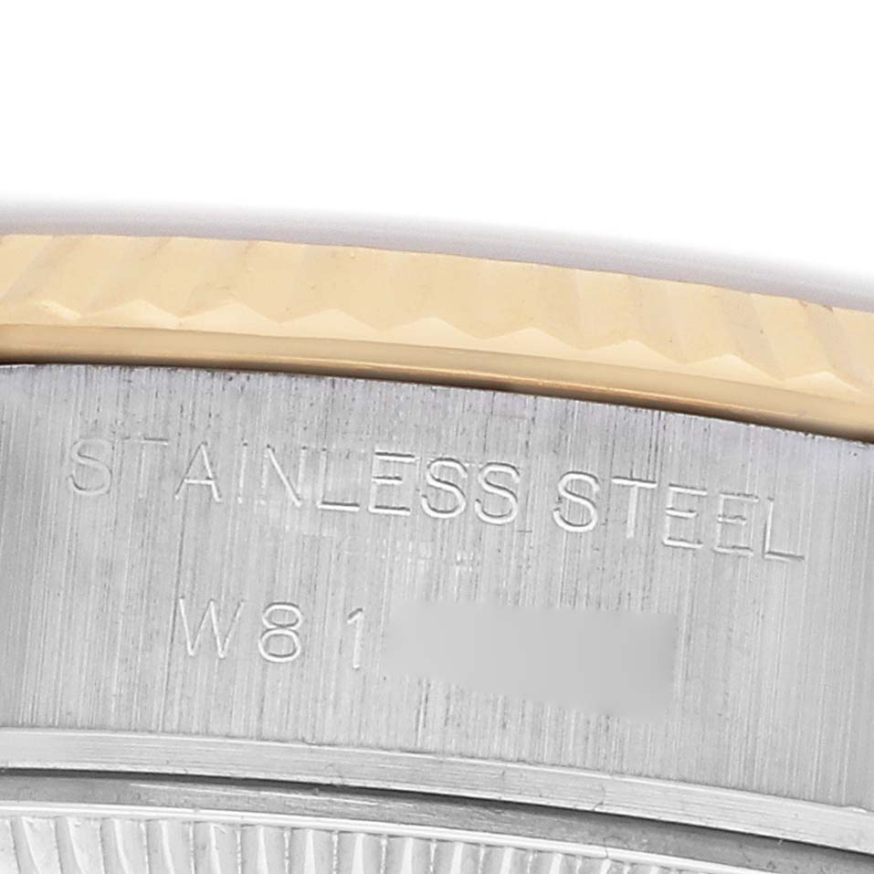 The image shows a close-up of the side of a Rolex Datejust 69173 Women's Steel and Gold (two tone) Champagne Dial watch, focusing on the stainless steel casing and part of the bezel.