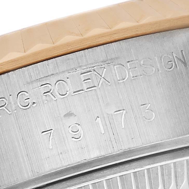 The image shows a close-up of the engraving on the side of a Rolex Datejust 79173 Women's Steel and Gold (two tone) White Dial 79173 Women's Steel and Gold (two tone) White Dial watch, highlighting the model number.