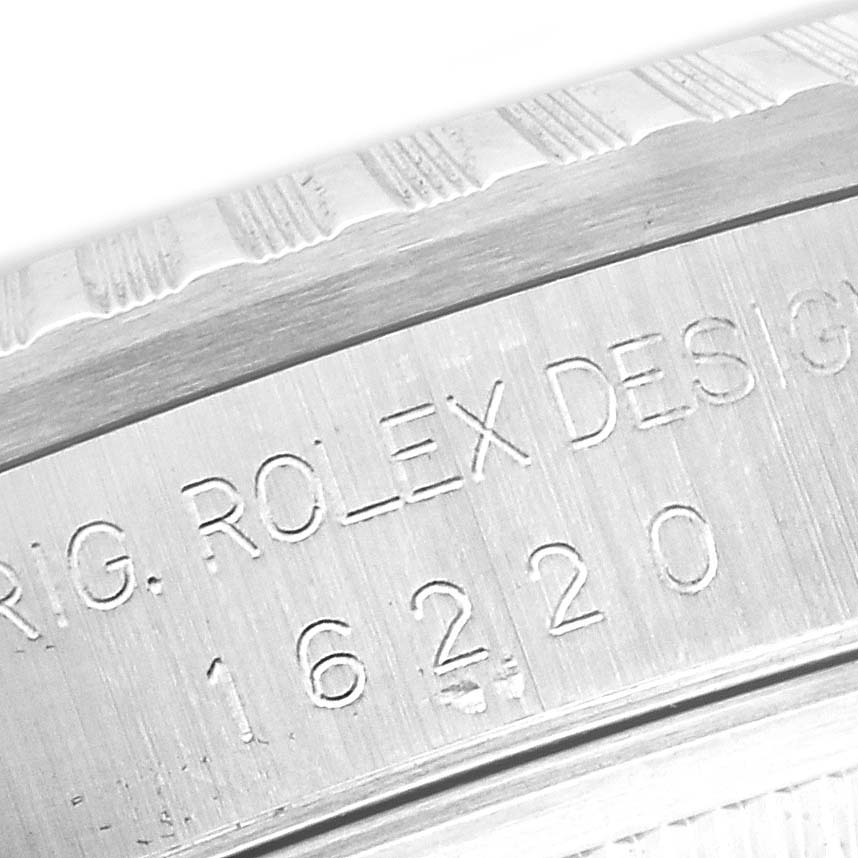 The image shows a close-up of the case back engraving, featuring the model number of a Rolex Datejust 16220 Men's Stainless Steel White Dial 16220 Men's Stainless Steel White Dial.