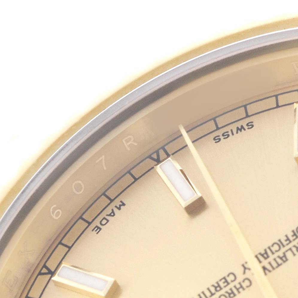 The image shows a close-up of the dial edge and markers of a Rolex President 218238 Men's Yellow Gold Champagne Dial watch, focusing on the details of the face and text.