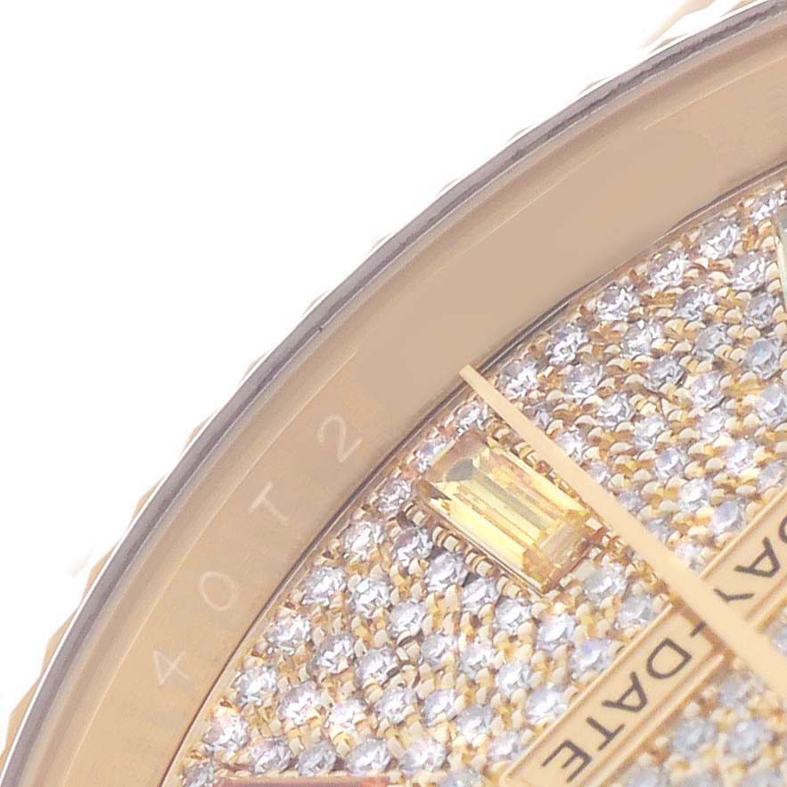 The image shows a close-up of the diamond-encrusted dial edge of a Rolex President 128238 Men's Yellow Gold Champagne Dial watch, focusing on the hour marker and "DAY-DATE" text.
