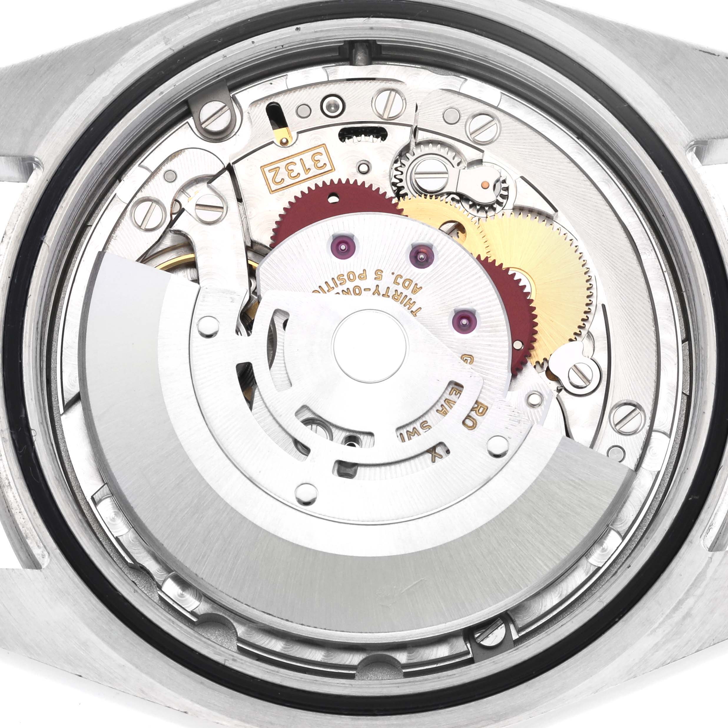 The image shows the movement of a Rolex Explorer 214270 Men
s Stainless Steel Black Dial 214270 Men
s Stainless Steel Black Dial watch with visible gears and rotor from the back.