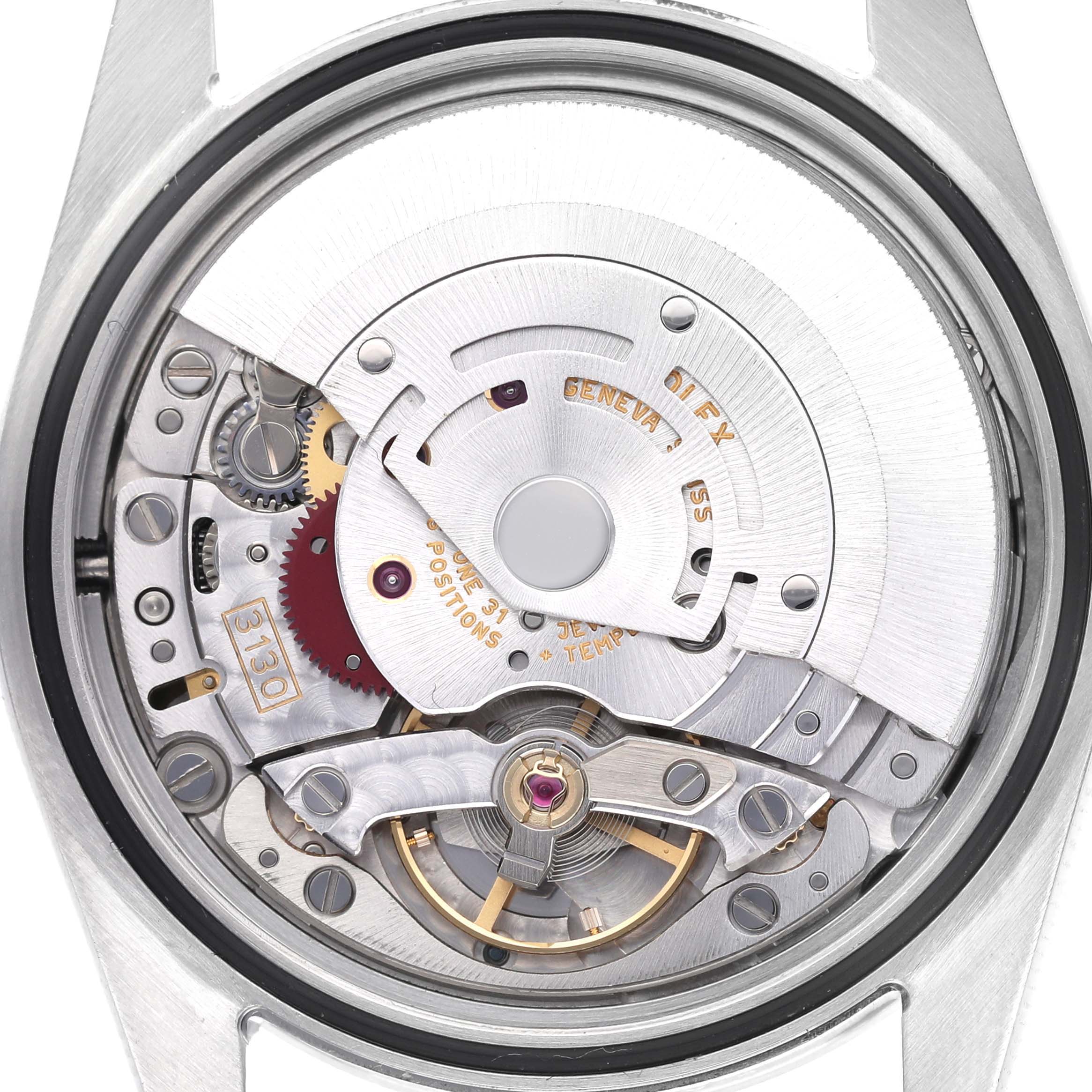 The image shows a detailed view of the Rolex Explorer 114270 Men
s Stainless Steel Black Dial 114270 Men
s Stainless Steel Black Dial
s movement from the back.