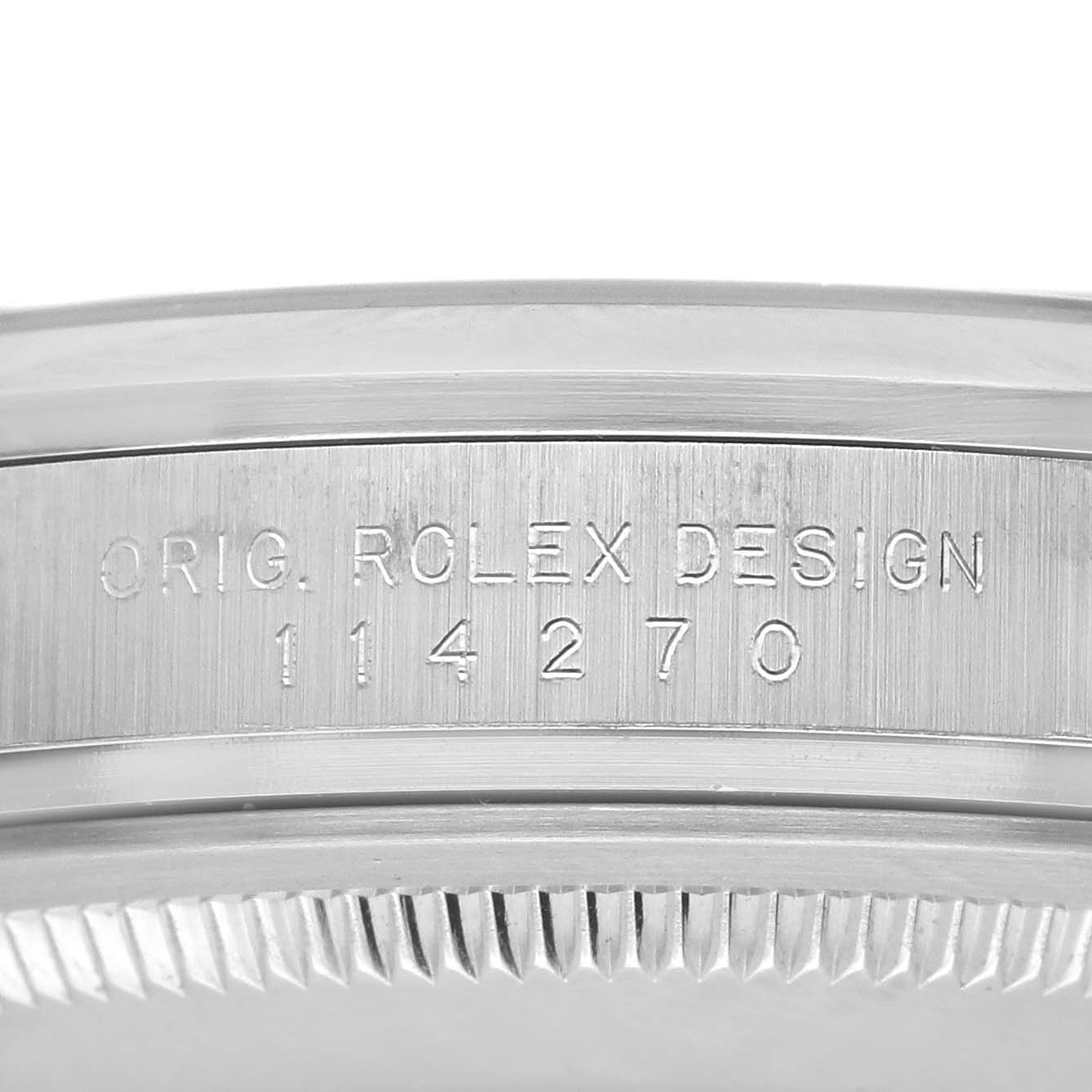 The image shows a close-up of the side case of the Rolex Explorer 114270 Men
s Stainless Steel Black Dial 114270 Men
s Stainless Steel Black Dial, featuring the engraving "ORIG. ROLEX DESIGN 114270".