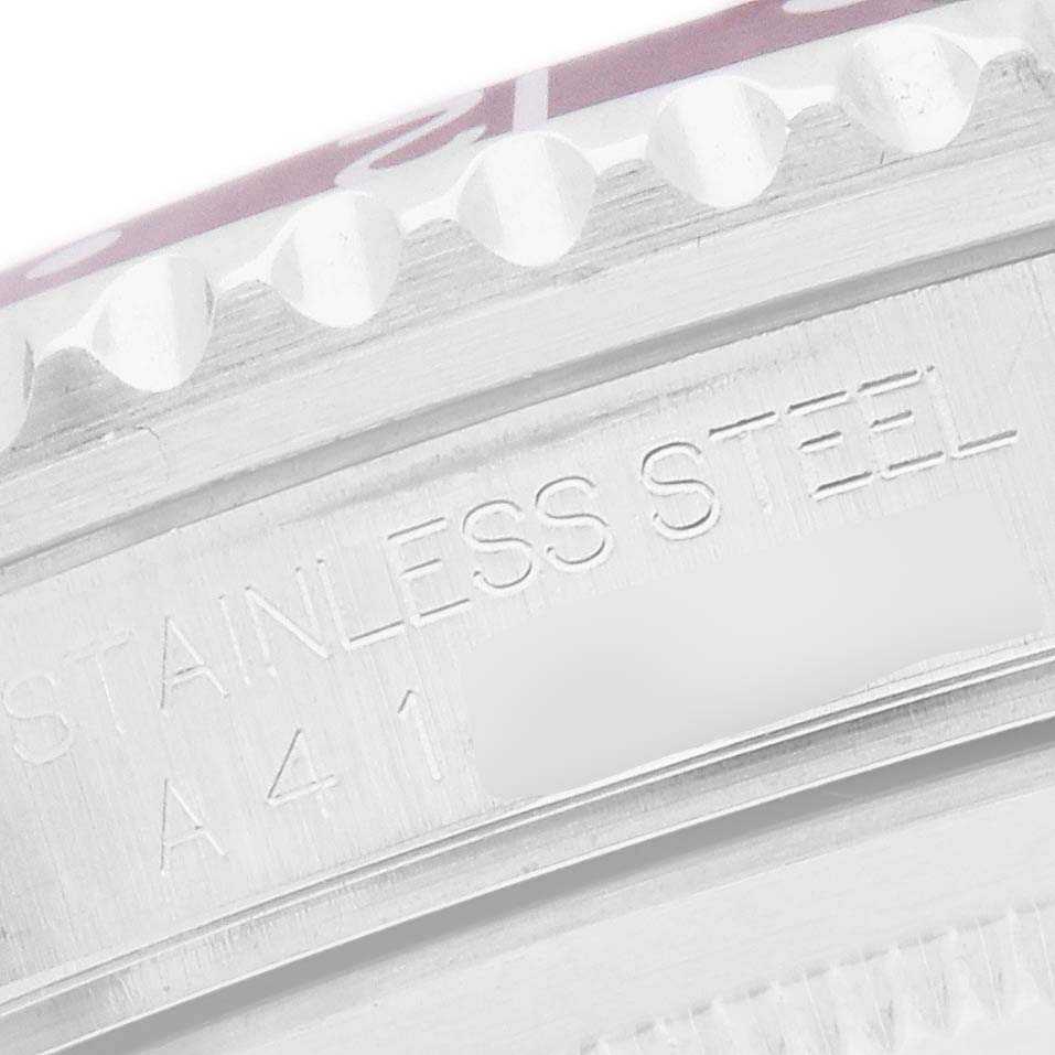 The image shows a close-up of the side of a Rolex GMT-Master 16700 Men's Stainless Steel Black Dial, highlighting the stainless steel engraving.