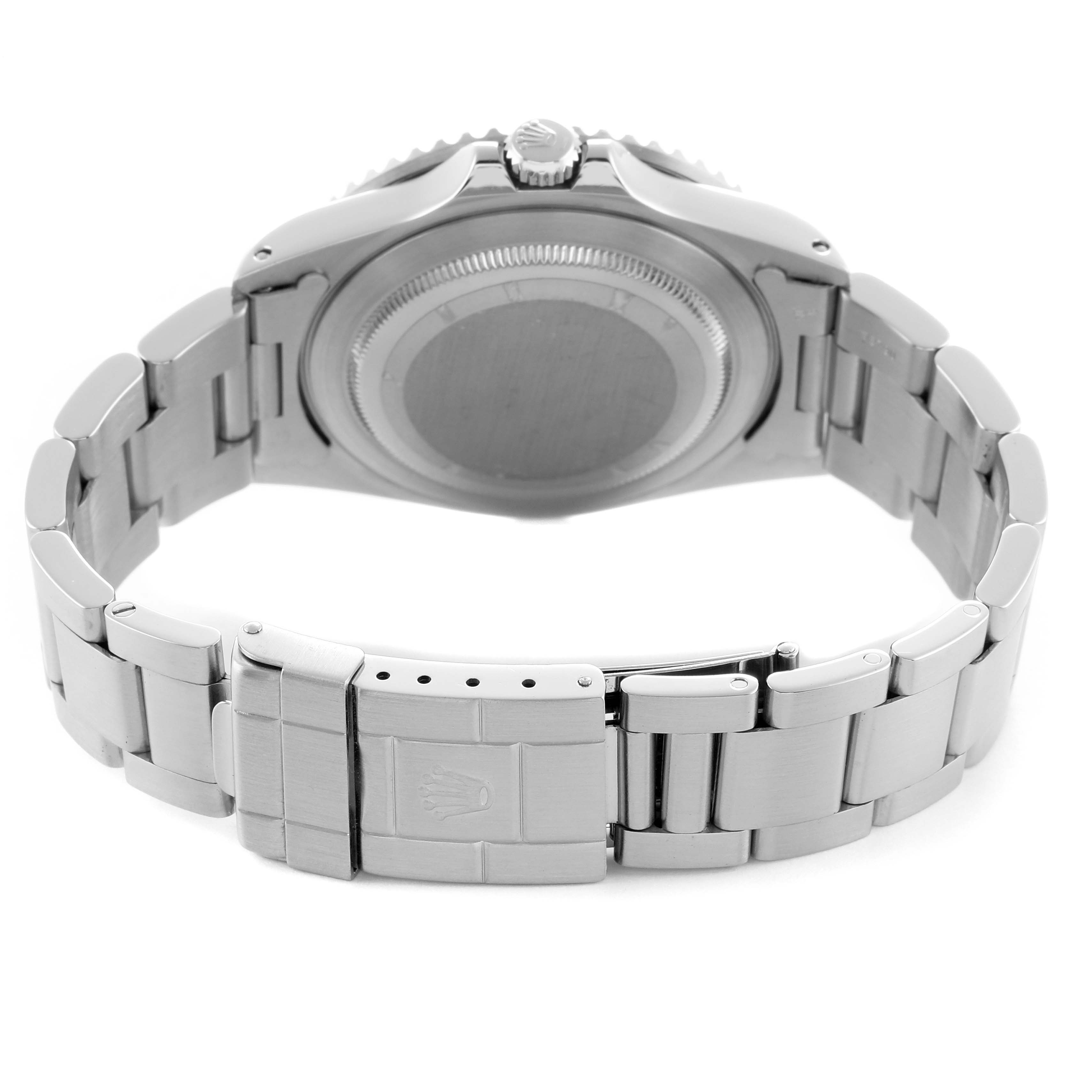 The image shows the back of a Rolex GMT-Master 16700 Men's Stainless Steel Black Dial watch, focusing on its closed clasp and bracelet from a rear angle.