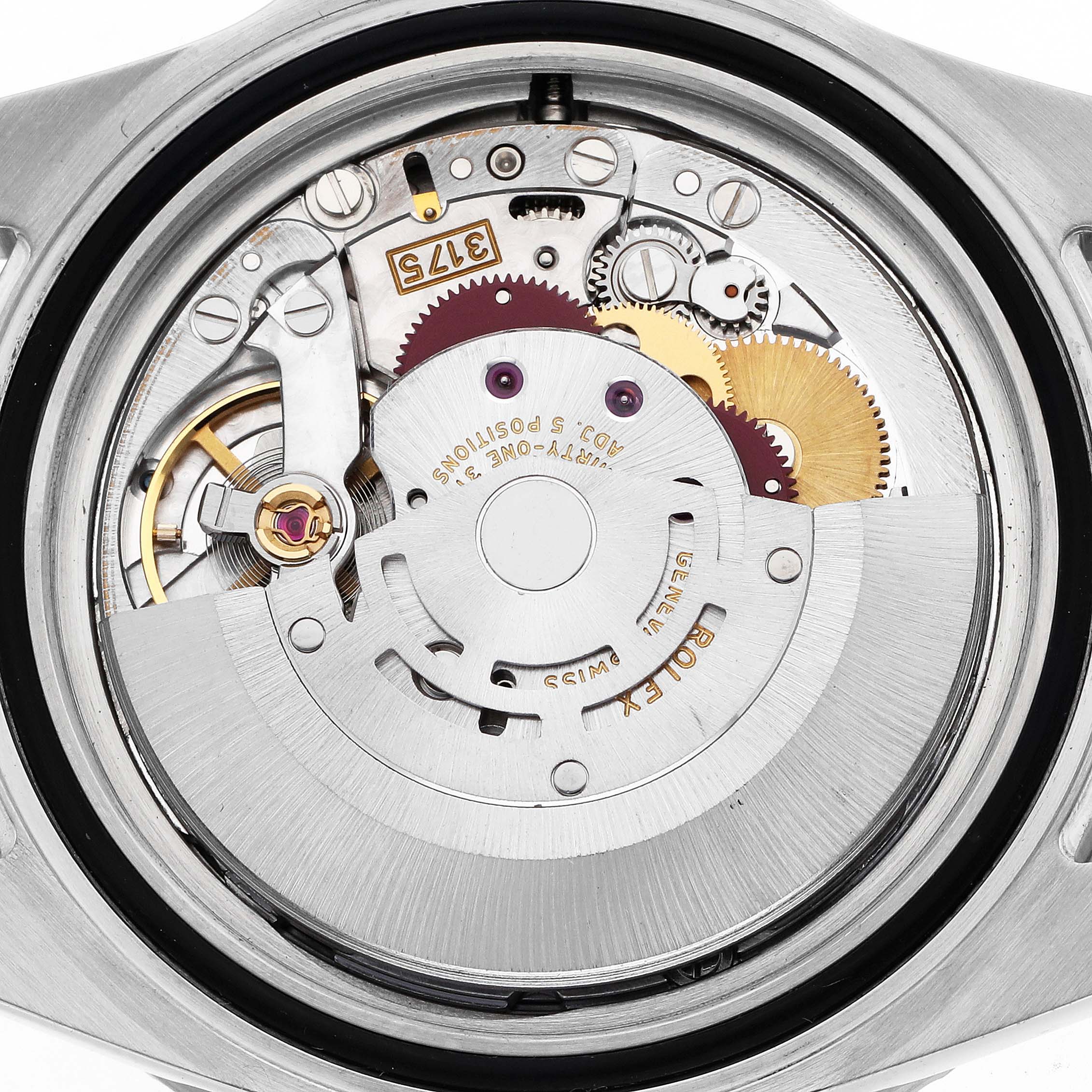 The image shows the movement of a Rolex GMT-Master 16700 Men's Stainless Steel Black Dial watch from a top-down angle, highlighting its intricate gears and components.