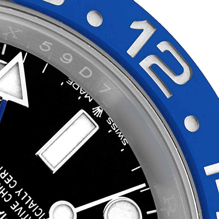 The image shows a close-up of the Rolex GMT-Master 126710 Men's Stainless Steel Black Dial's bezel, part of the dial, and markers from an angled view.