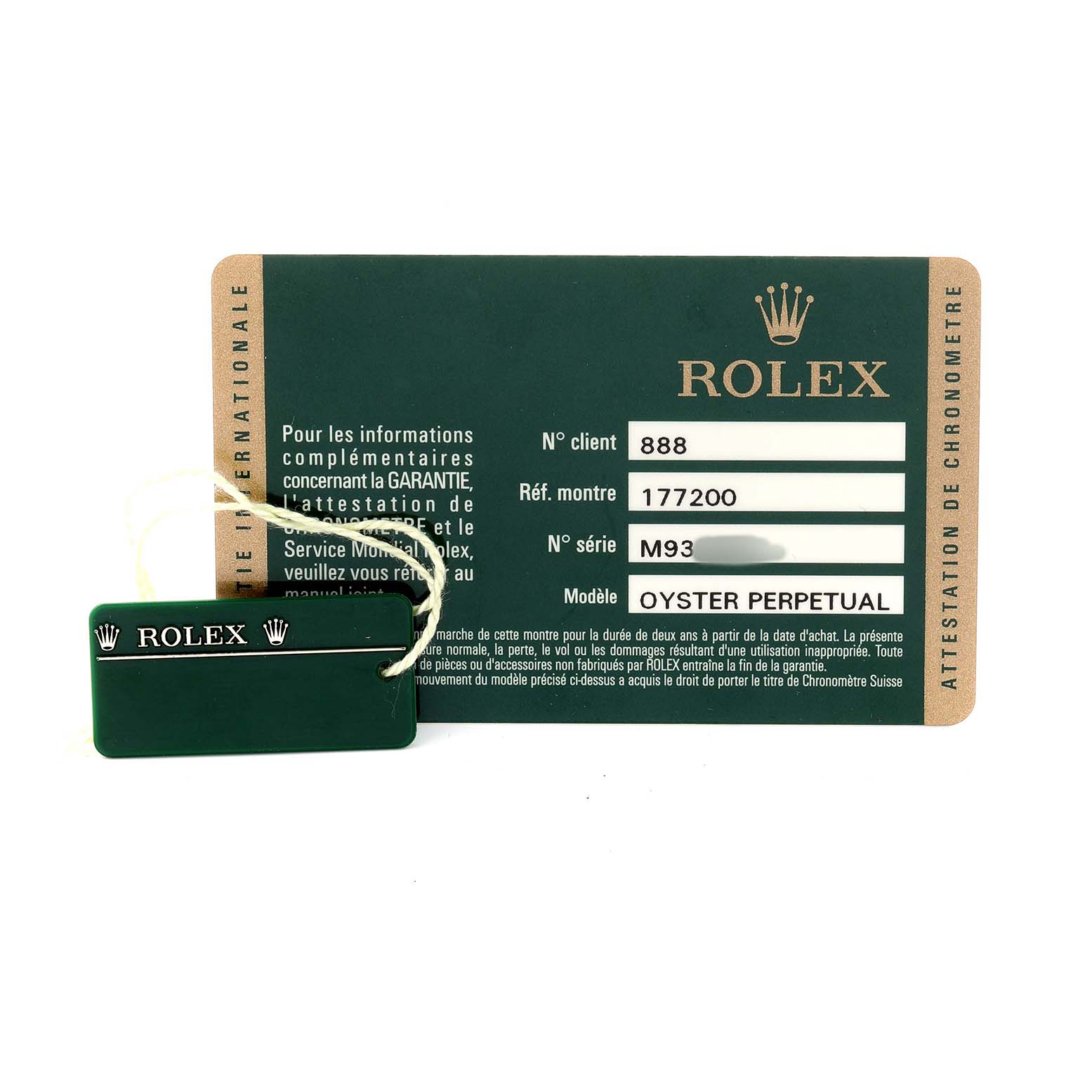 The image shows a Rolex Oyster Perpetual card with reference and serial numbers, accompanied by a green tag.