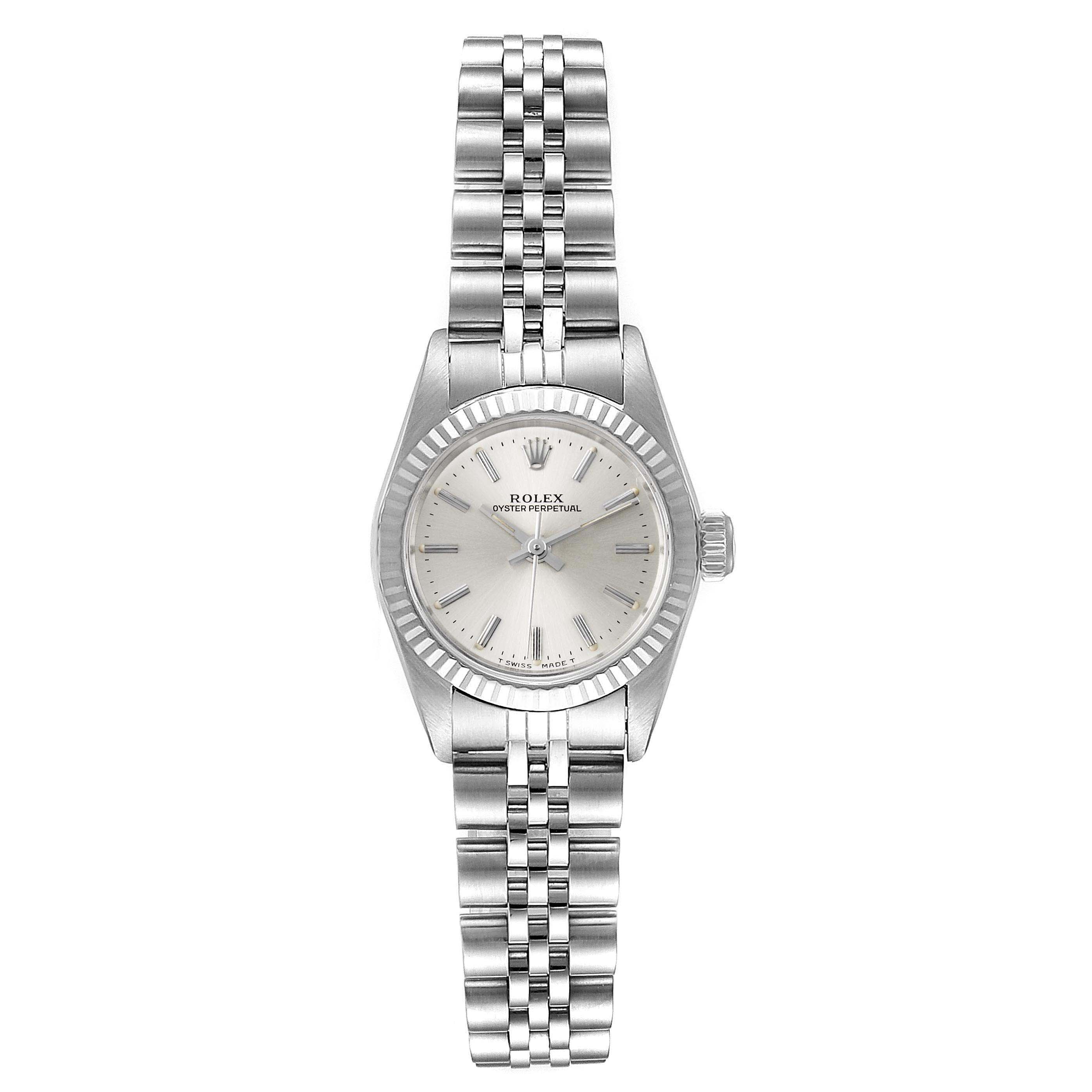 This image shows a Rolex Oyster Perpetual 67194 Women's Stainless Steel Silver Dial 67194 Women's Stainless Steel Silver Dial watch from a top-down angle, displaying the face, bracelet, and crown.