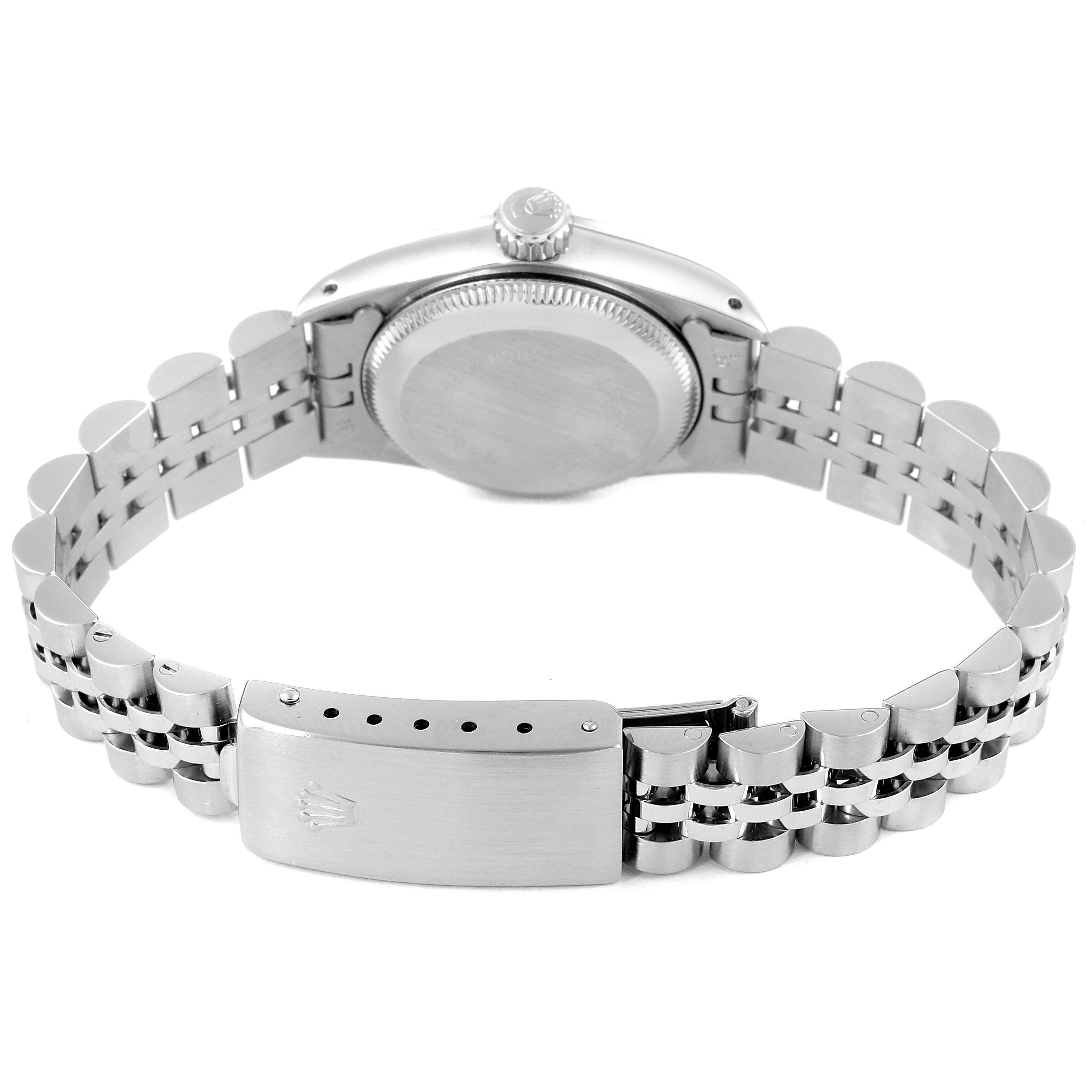 The image shows the back view of a Rolex Oyster Perpetual 67194 Women's Stainless Steel Silver Dial 67194 Women's Stainless Steel Silver Dial watch, highlighting its clasp and bracelet.