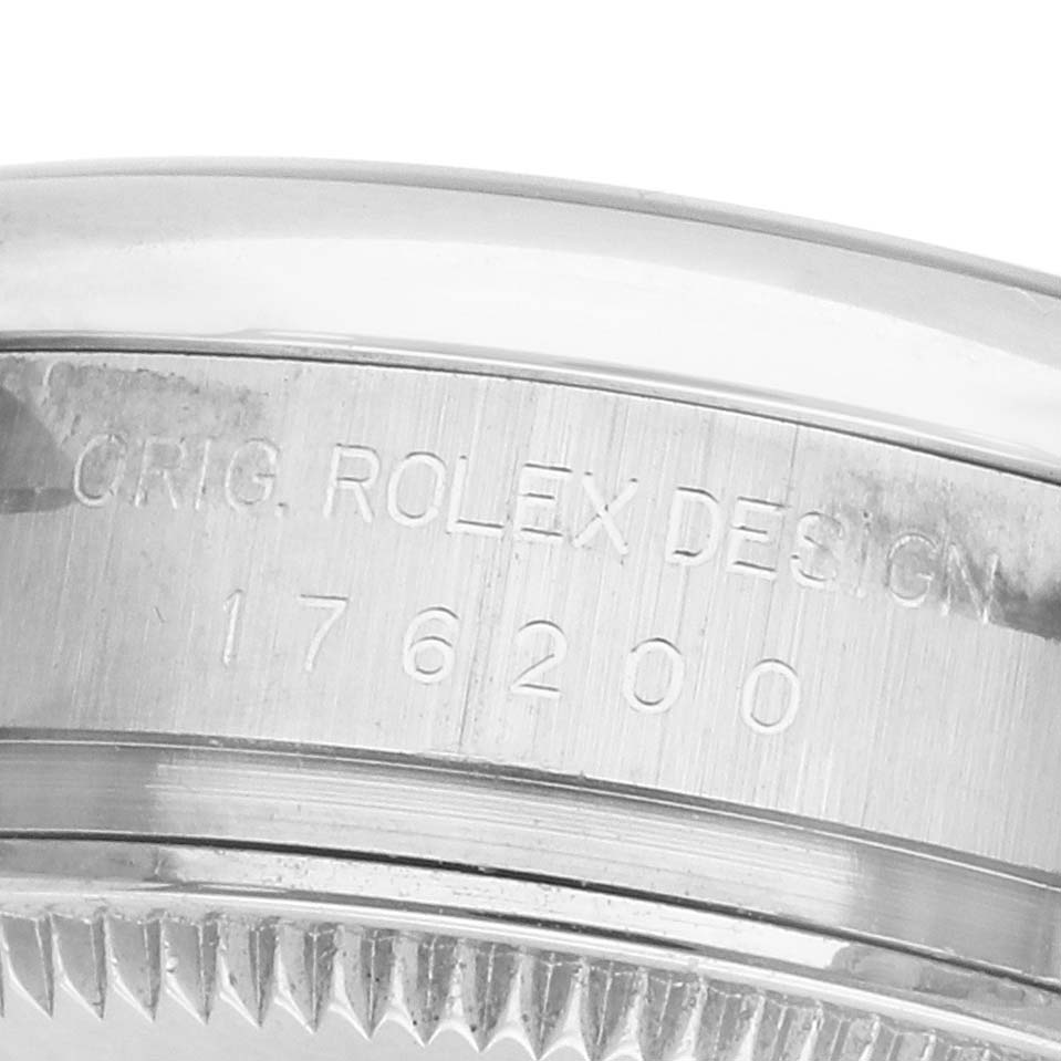 The image shows the side of a Rolex Oyster Perpetual 176200 Men's Stainless Steel Silver Dial watch case, featuring engraved branding and model numbers.