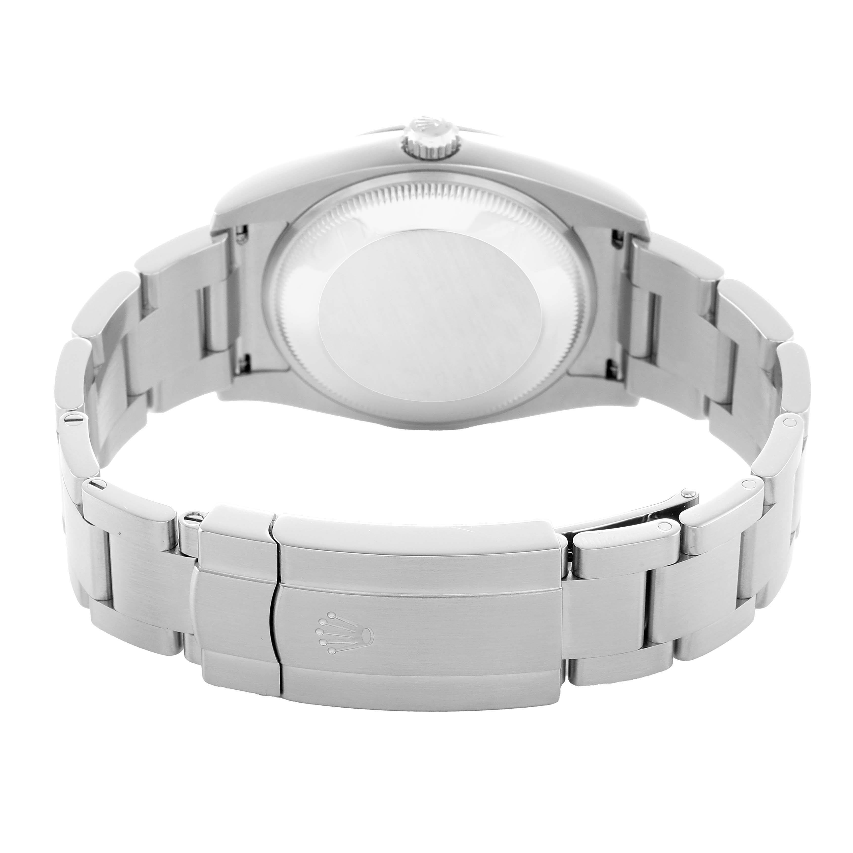 The image shows the Rolex Oyster Perpetual 114200 Men's Stainless Steel Purple Dial watch from the back, highlighting the case back and clasp.