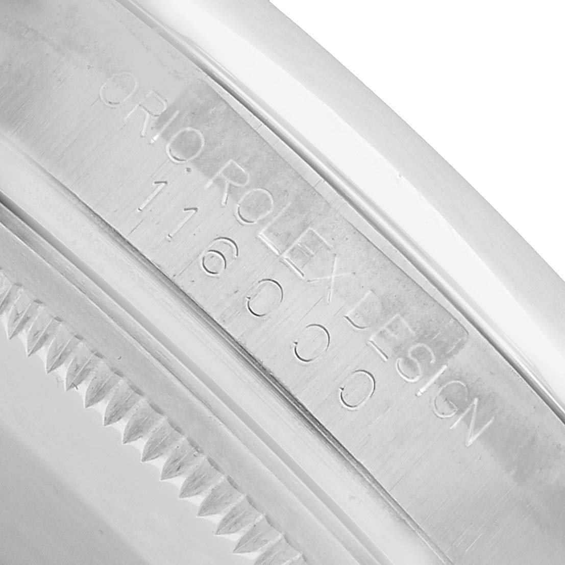 The image shows the side of the Rolex Oyster Perpetual 76276 Men's Stainless Steel Silver Dial, focusing on the engraved design and model number.