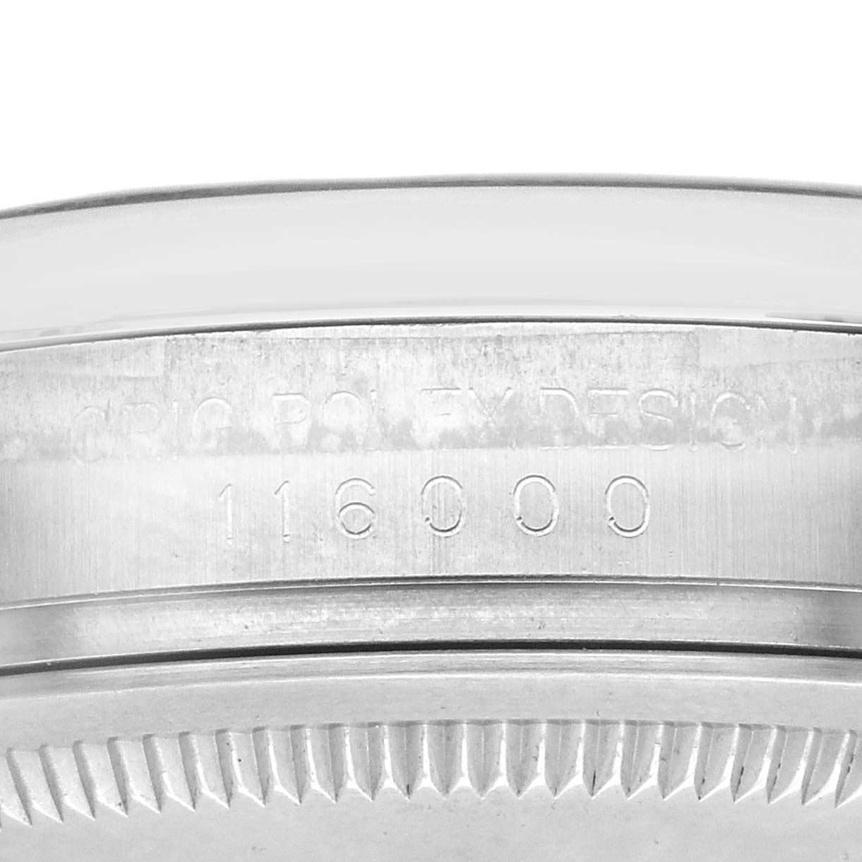 The image shows a close-up of the side engraving and bezel of a Rolex Oyster Perpetual 116000 Men's Stainless Steel Silver Dial watch.