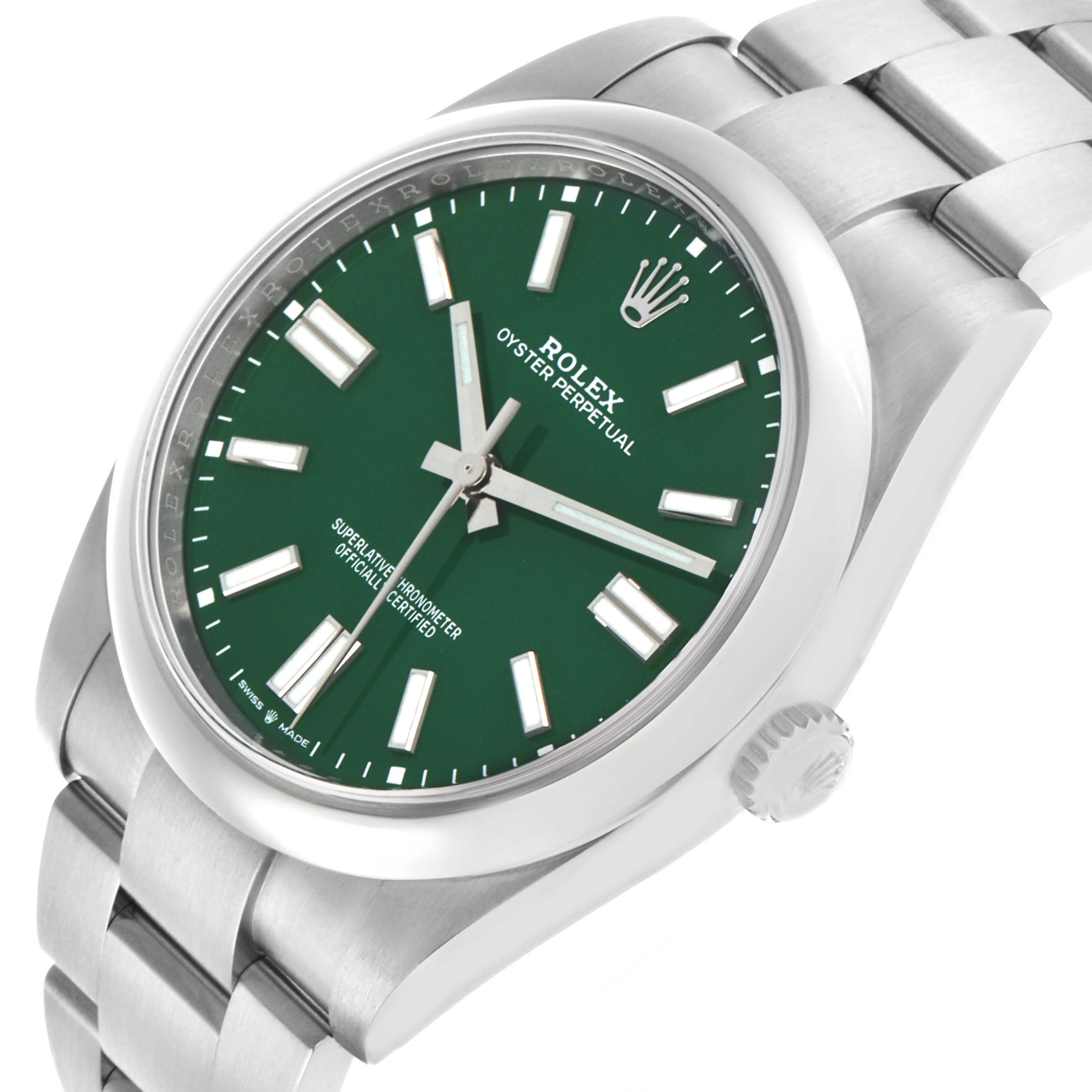 The Rolex Oyster Perpetual 124300 Men's Stainless Steel Green Dial watch is shown from a three-quarter angle, highlighting the green dial, markers, and stainless steel bracelet.