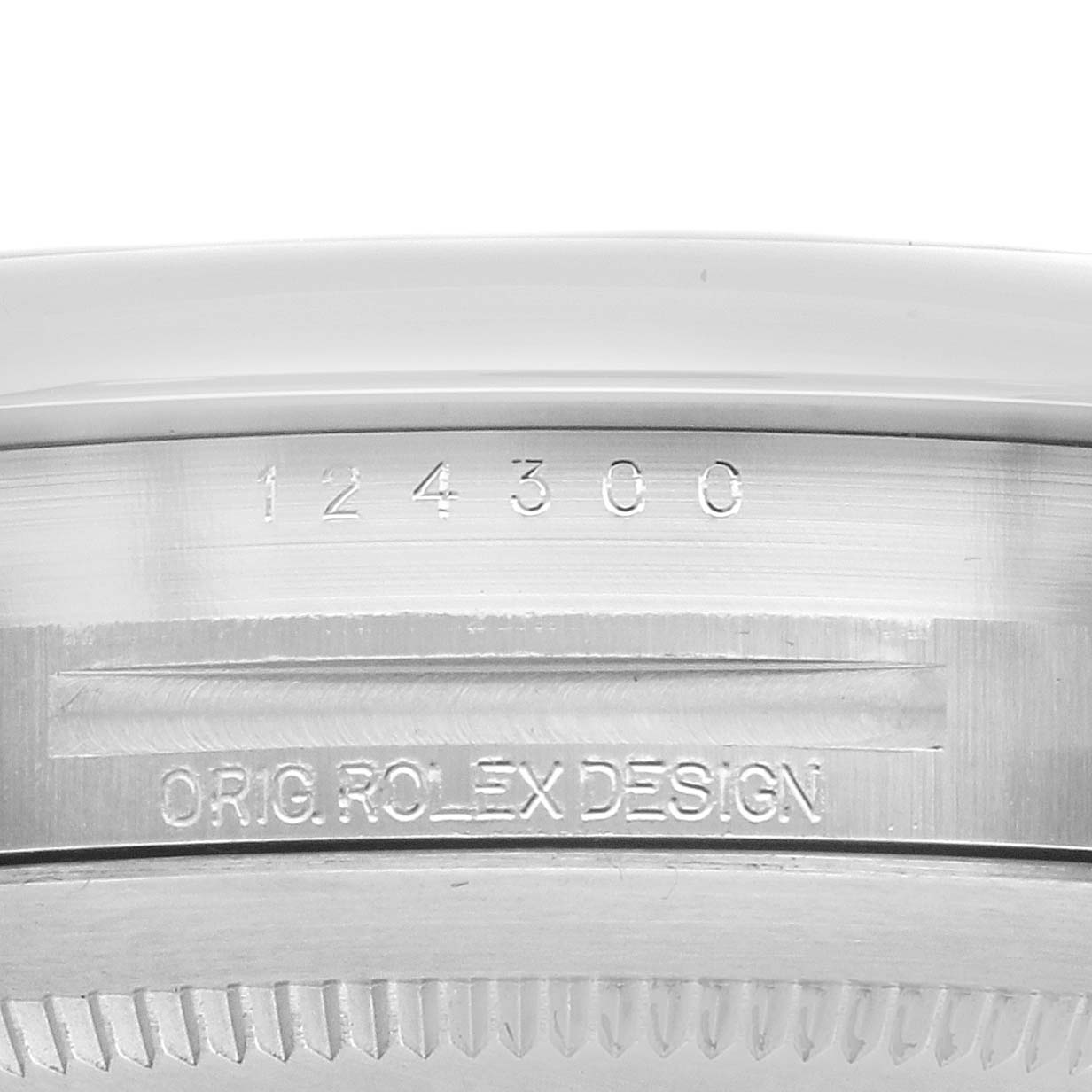 The image shows the side of a Rolex Oyster Perpetual 124300 Men's Stainless Steel Green Dial watch, highlighting the engraved model number and "ORIG ROLEX DESIGN."