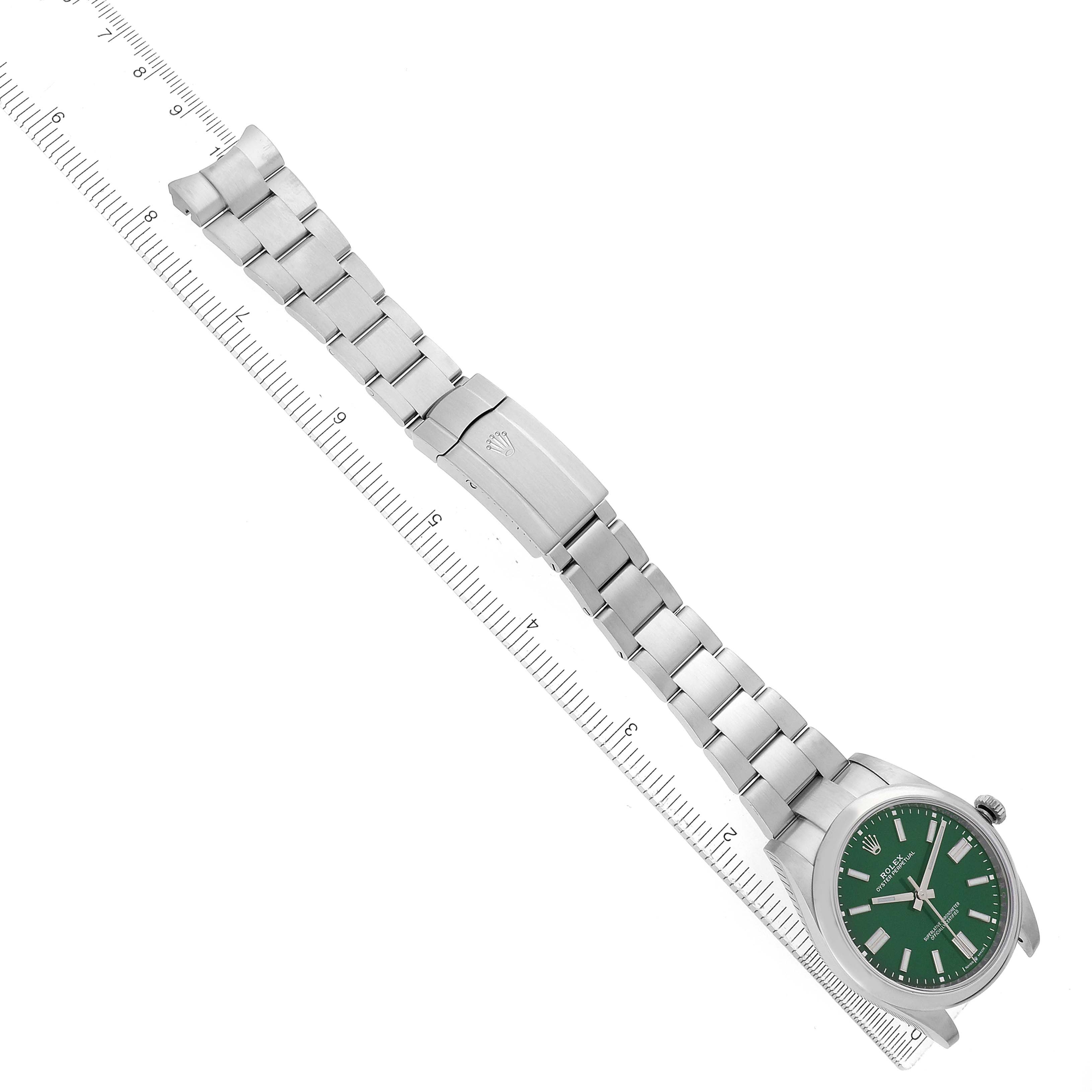 The Rolex Oyster Perpetual 124300 Men's Stainless Steel Green Dial watch is shown from a top-down angle, displaying the full bracelet, clasp, and green dial.