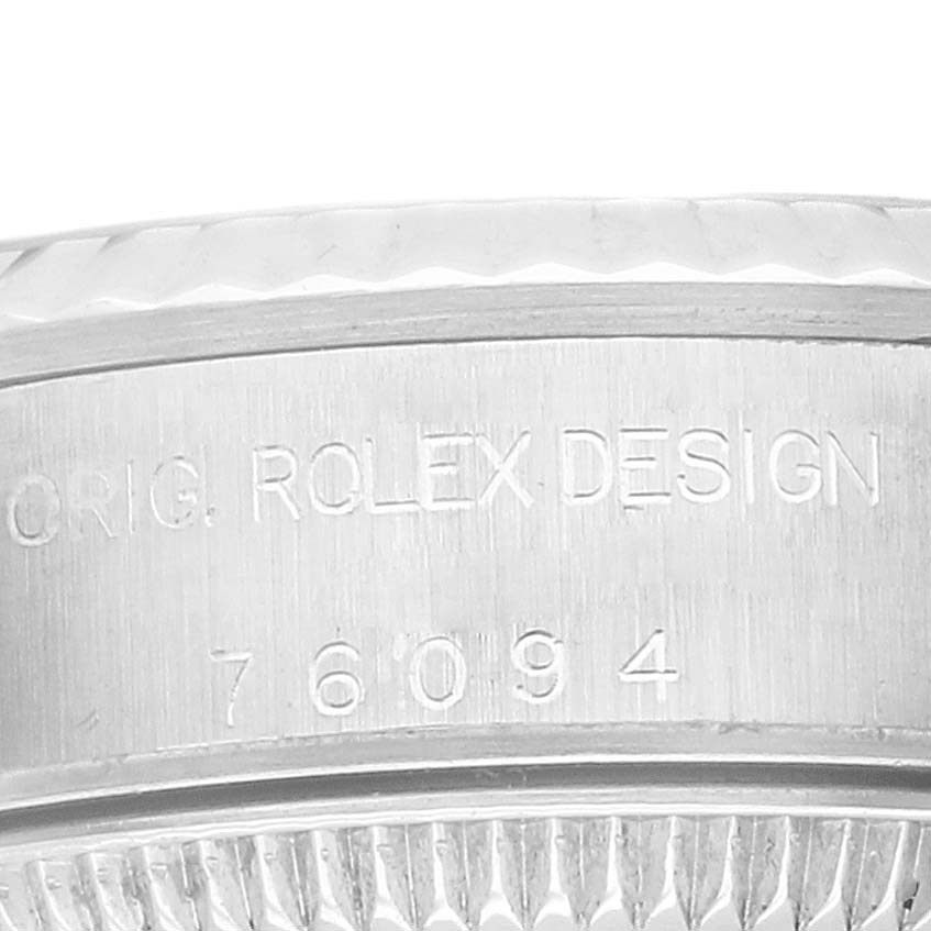 This image shows a close-up side view of the casing, with the "Orig. Rolex Design" and model number 76094 engraved on the Rolex Oyster Perpetual 76094 Women's Stainless Steel Black Dial.