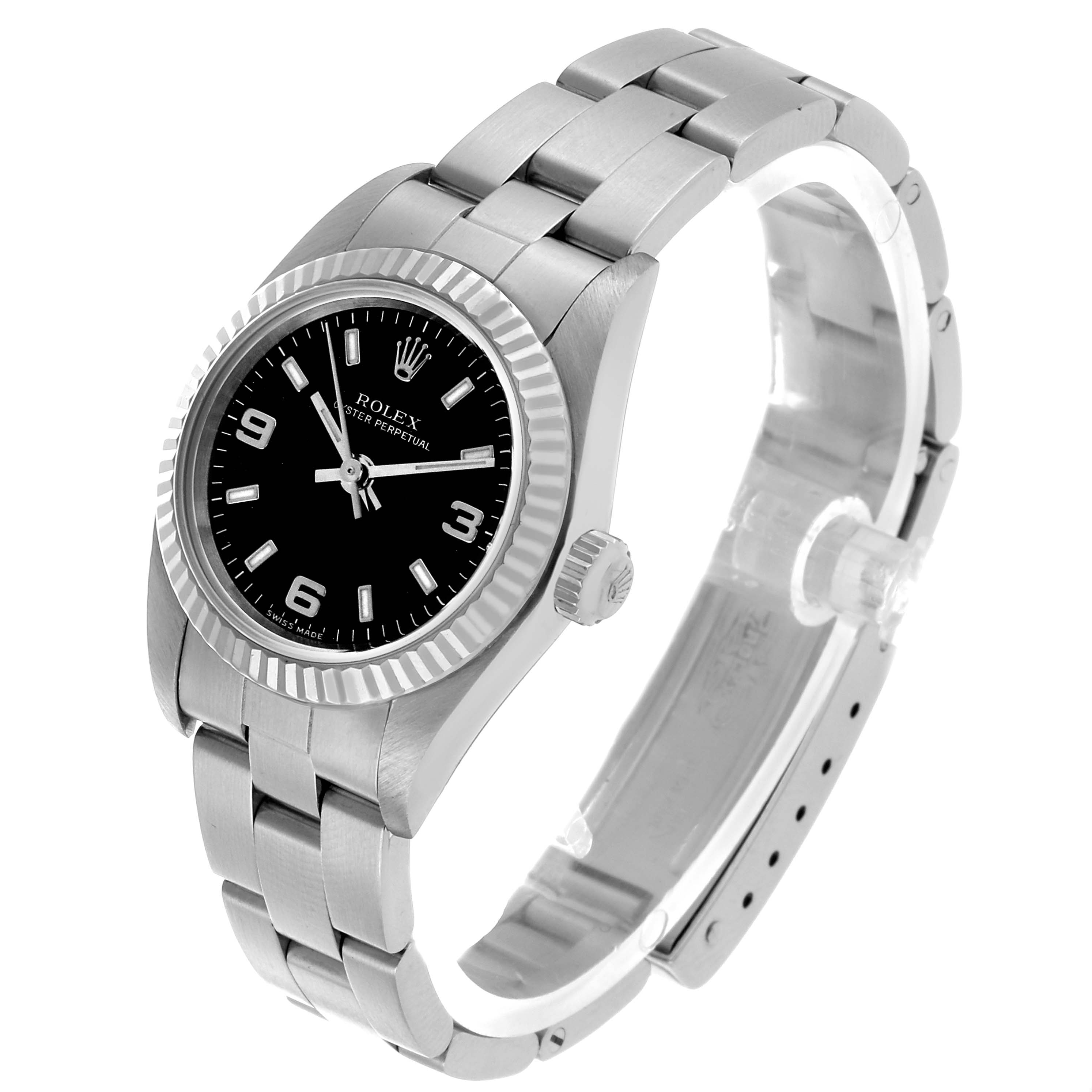 The Rolex Oyster Perpetual 76094 Women's Stainless Steel Black Dial watch is shown at an angled side view, highlighting the bezel, crown, bracelet, and dial.