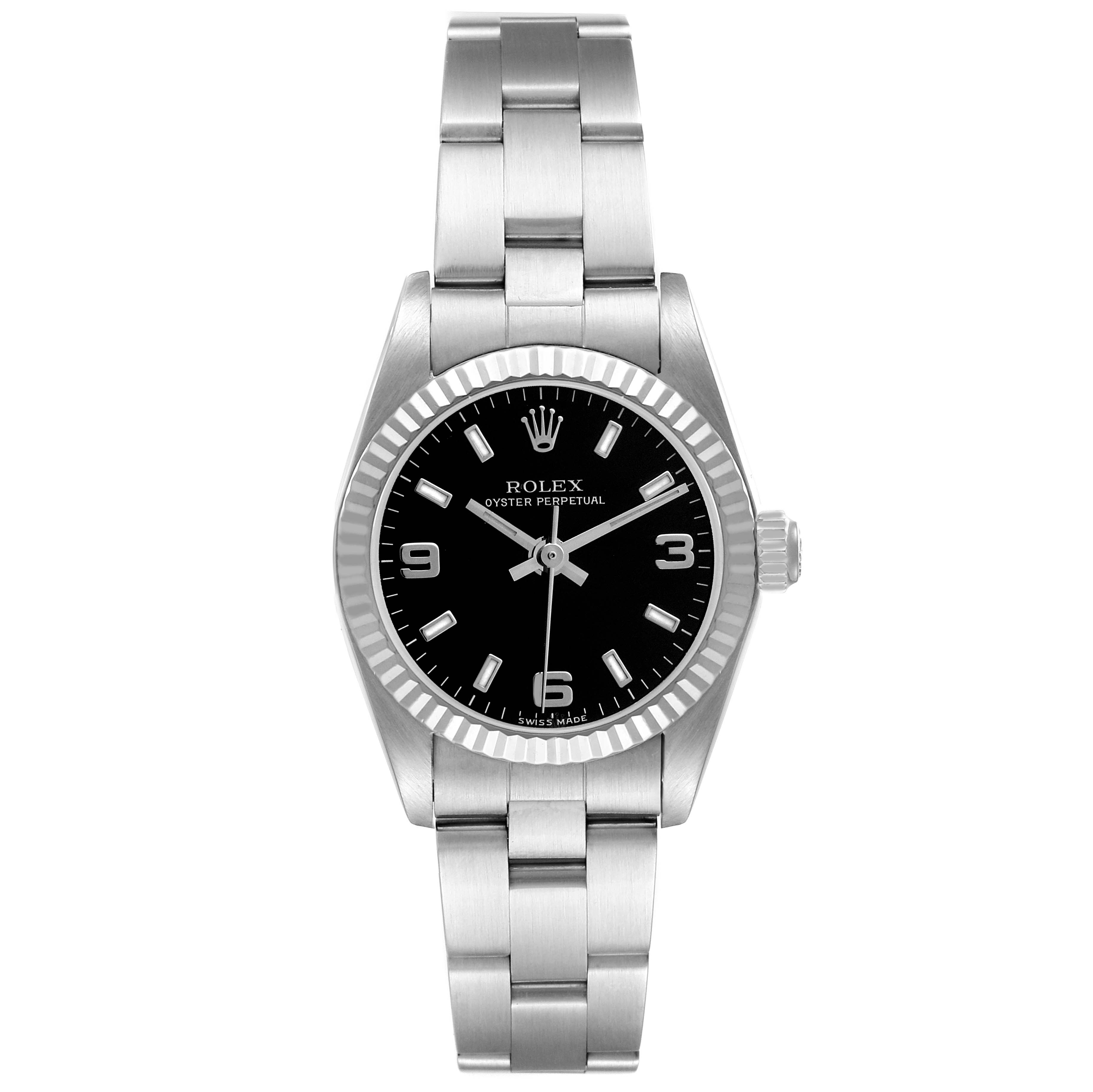 The Rolex Oyster Perpetual 76094 Women's Stainless Steel Black Dial is shown from a straightforward angle, highlighting its face, bezel, and bracelet.
