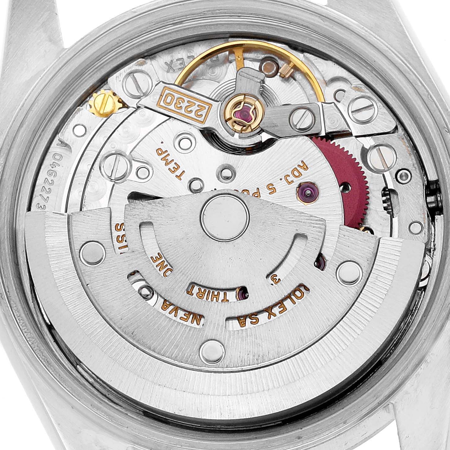 This image shows the movement of a Rolex Oyster Perpetual 76080 Women's Stainless Steel Silver Dial watch from a top-down angle, highlighting its rotor and internal components.
