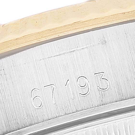 This close-up shows the model number engraving on the side of the Rolex Oyster Perpetual 67193 Women's Steel and Gold (two tone) Champagne Dial 67193 Women's Steel and Gold (two tone) Champagne Dial watch case.