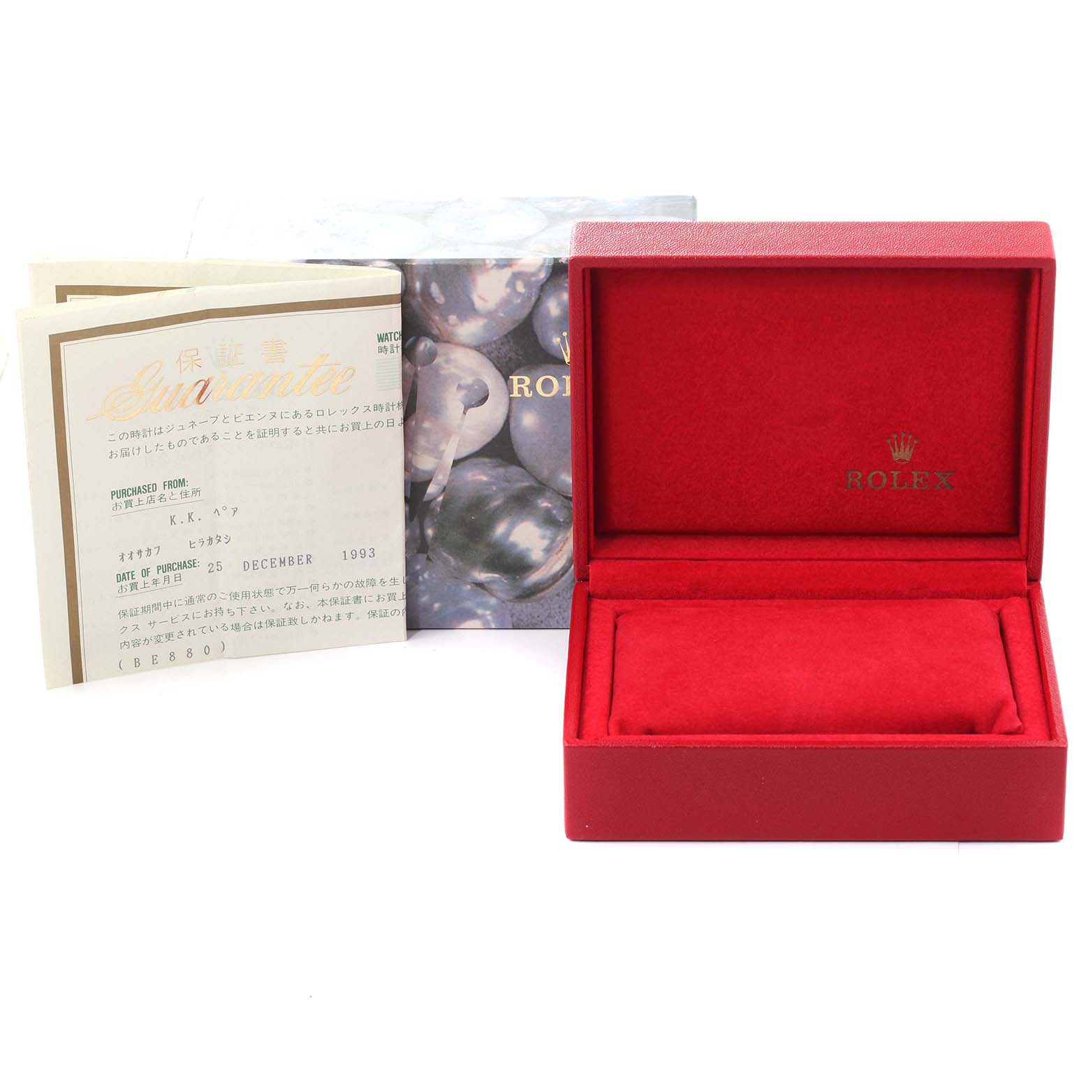 This image shows the box and documentation for a Rolex Oyster Perpetual 67193 Women's Steel and Gold (two tone) Champagne Dial 67193 Women's Steel and Gold (two tone) Champagne Dial watch, including the warranty card and original packaging.