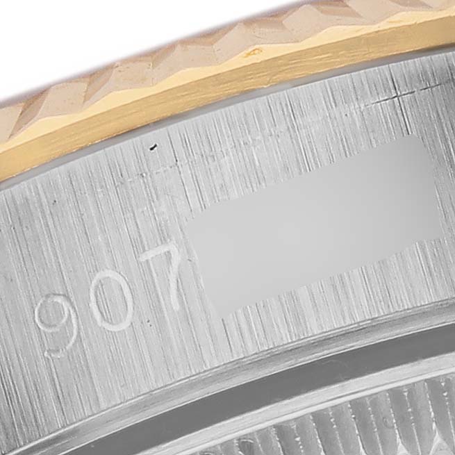 The image shows a close-up of the case edge and bezel of a Rolex Oyster Perpetual 67193 Women
s Steel and Gold (two tone) White Dial 67193 Women
s Steel and Gold (two tone) White Dial watch.
