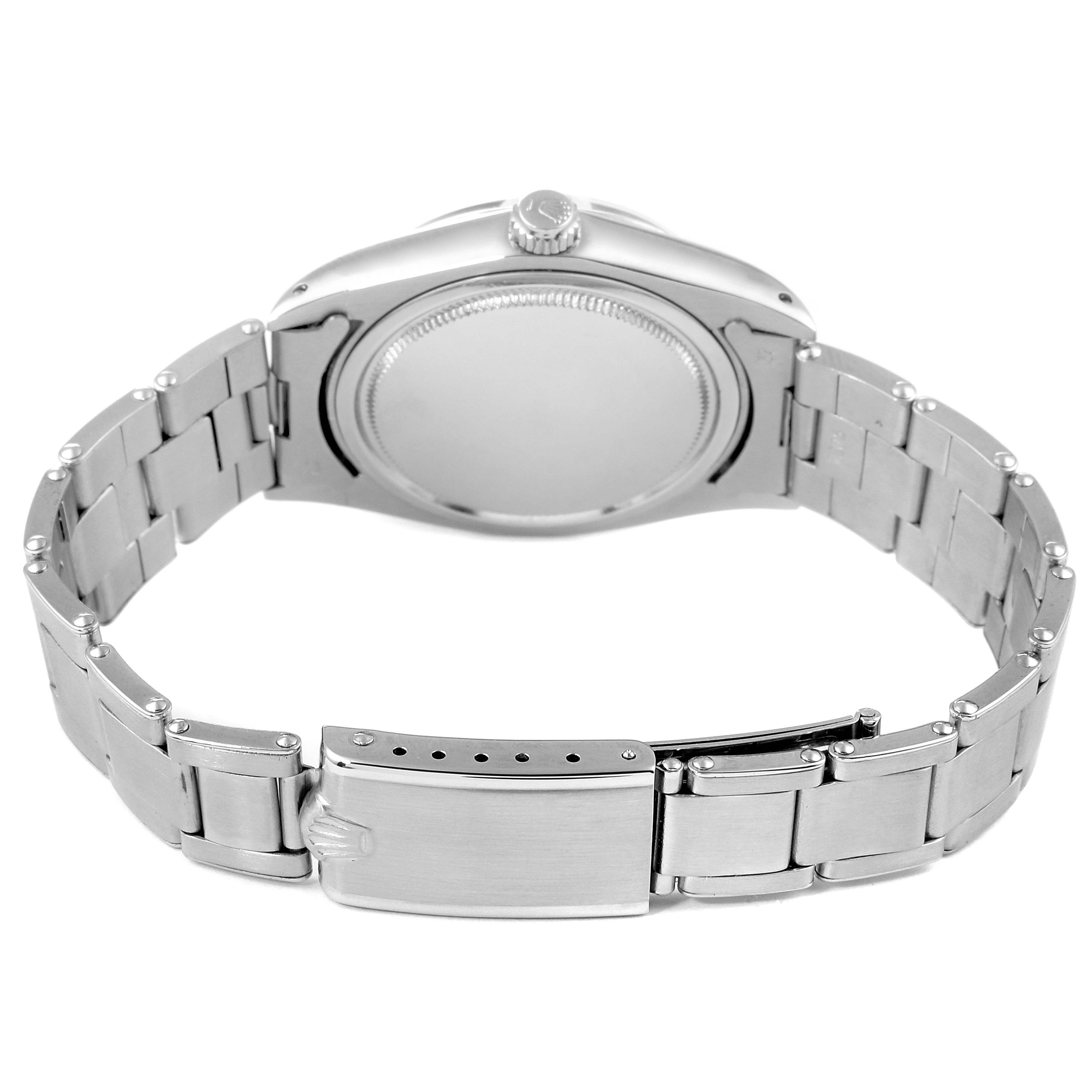 The image shows the back and bracelet of the Rolex Vintage Collection 6694 Men
s Stainless Steel Silver Dial 6694 Men
s Stainless Steel Silver Dial watch, highlighting the case back, crown, and clasp.