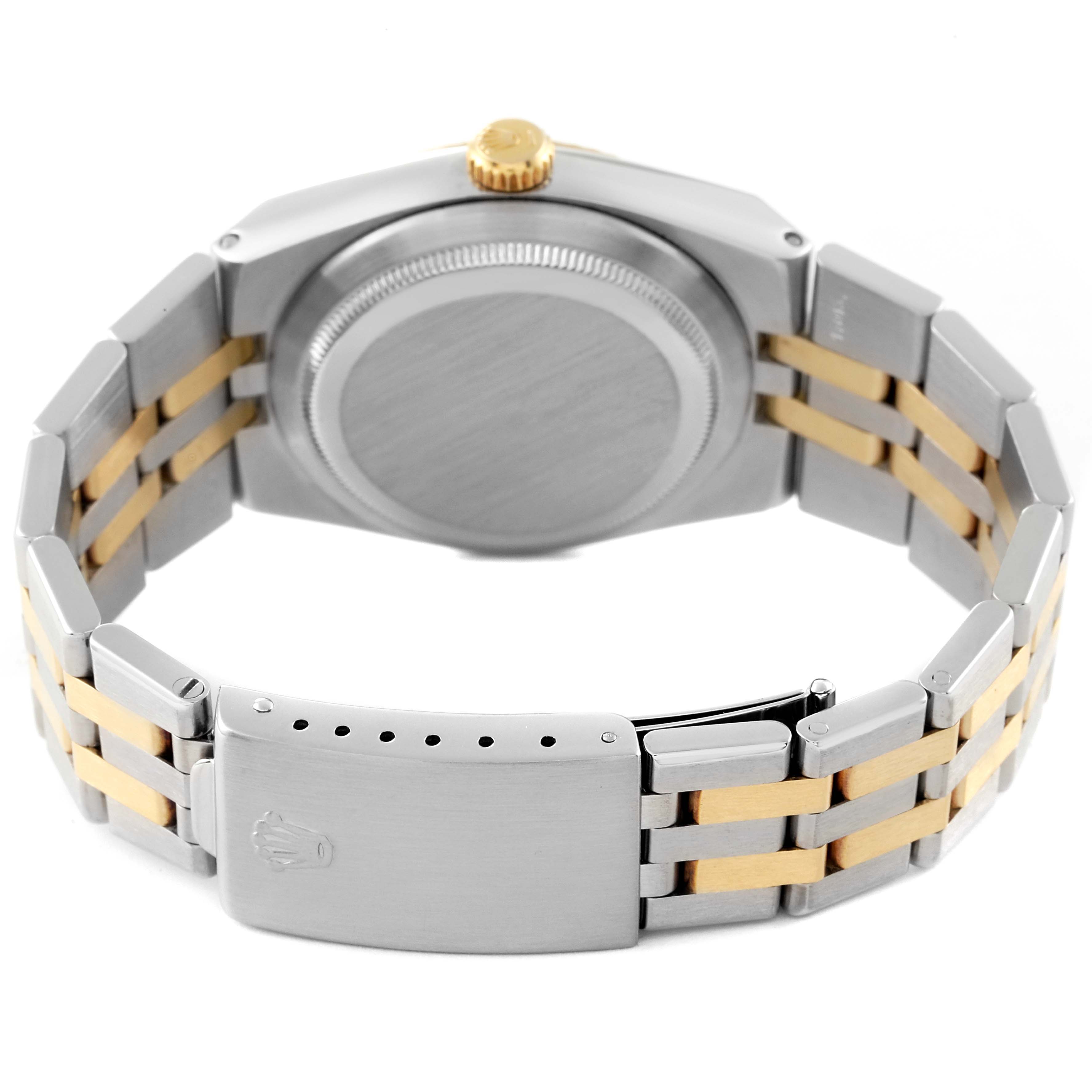 The image shows the back view of a Rolex Oysterquartz 17013 Men's Steel and Gold (two tone) Champagne Dial 17013 Men's Steel and Gold (two tone) Champagne Dial watch, highlighting its case, crown, and two-tone metal bracelet.