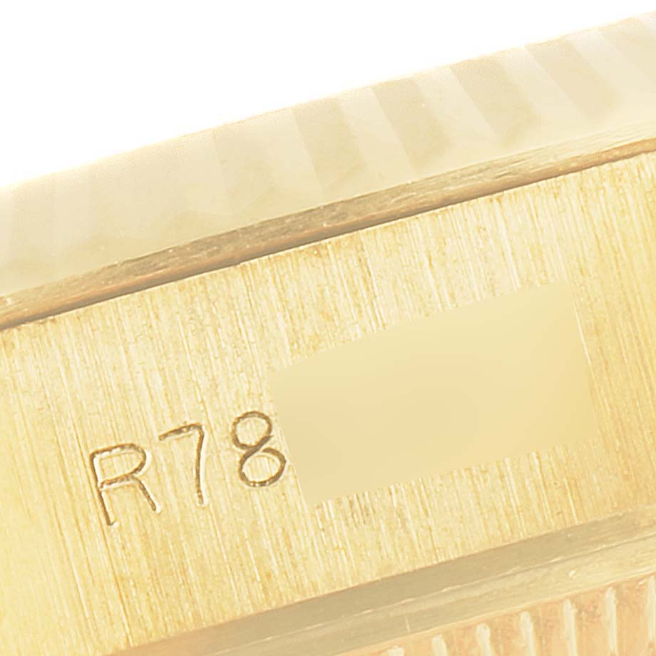 This image shows a close-up of the engraved serial number on the side of a Rolex President 69178 Women
s Yellow Gold Champagne Dial 69178 Women
s Yellow Gold Champagne Dial model watch case.