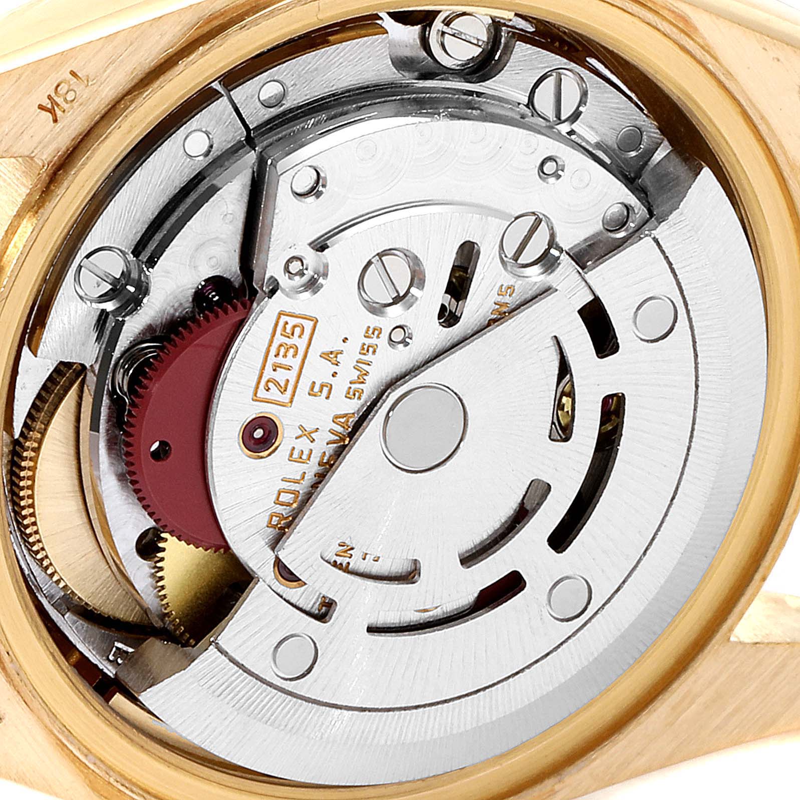 The image shows a close-up of the mechanical movement inside a Rolex President 69178 Women
s Yellow Gold Champagne Dial 69178 Women
s Yellow Gold Champagne Dial model watch.