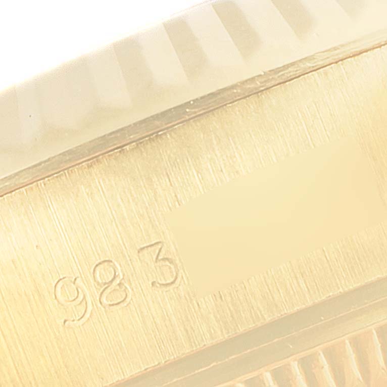 This close-up image shows the side of the Rolex President 69178 Women
s Yellow Gold Champagne Dial 69178 Women
s Yellow Gold Champagne Dial model watch, highlighting the serial number engraving.