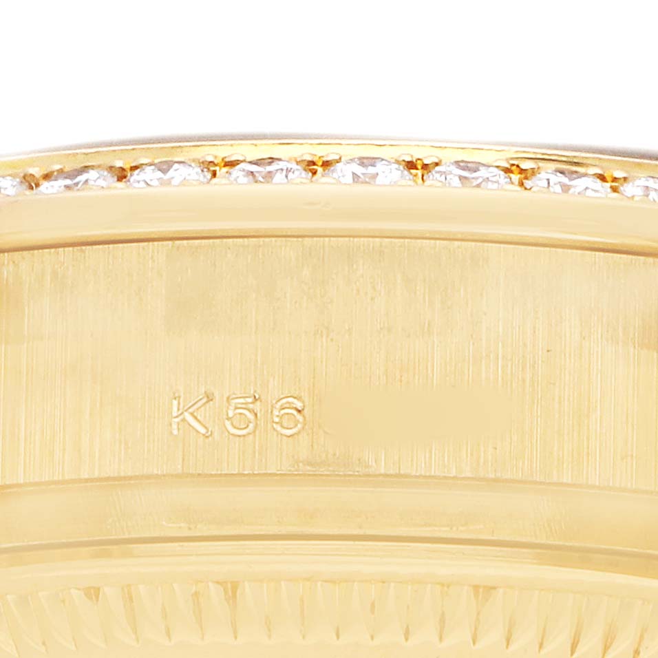 The image shows a close-up of the side of a Rolex President 179158 Women's Yellow Gold Mother of Pearl Dial watch, featuring a gold finish and diamond-encrusted bezel.