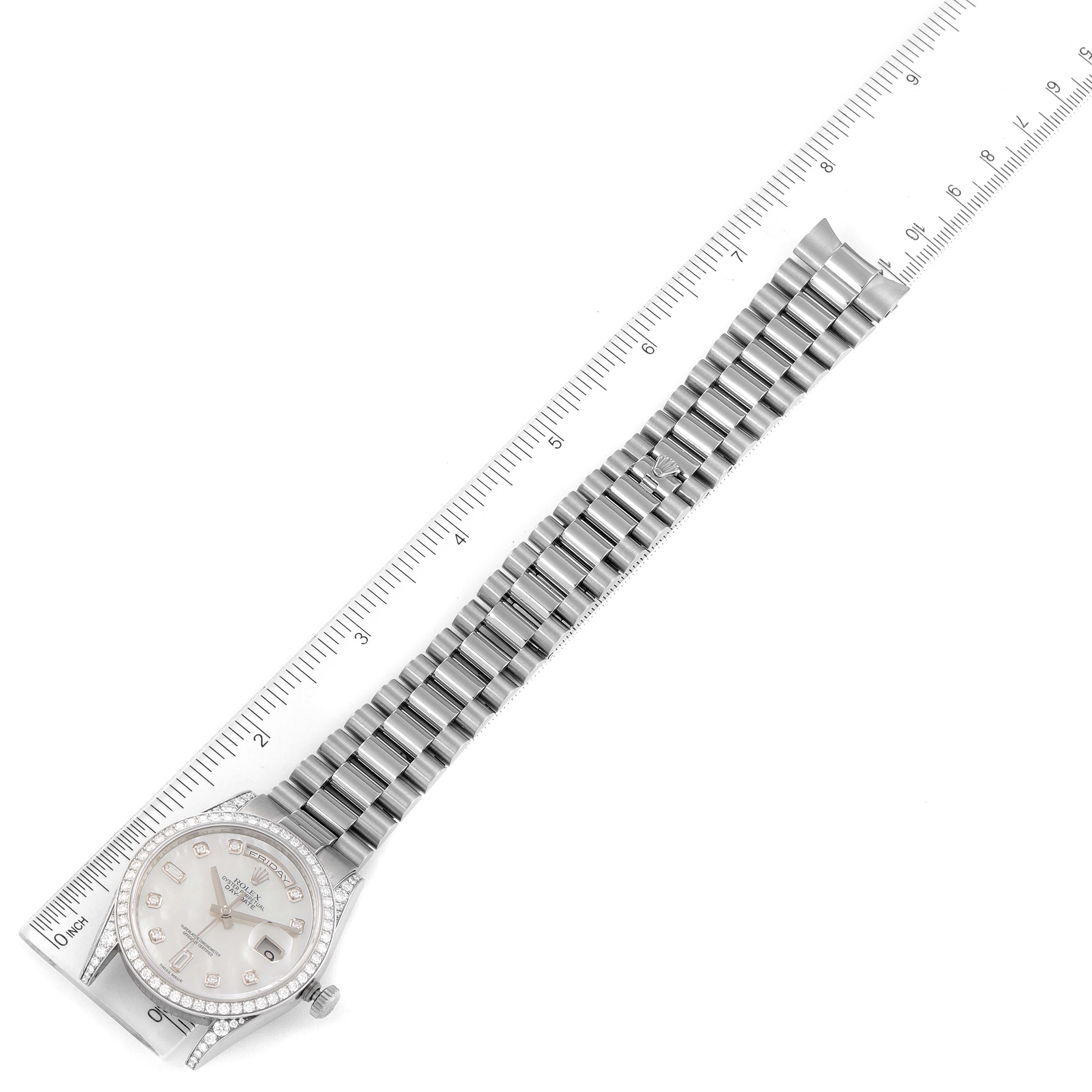 The image shows a Rolex President 118389 Men's White Gold Mother of Pearl Dial 118389 Men's White Gold Mother of Pearl Dial model watch laid flat with its bracelet extended and a ruler alongside it for scale.