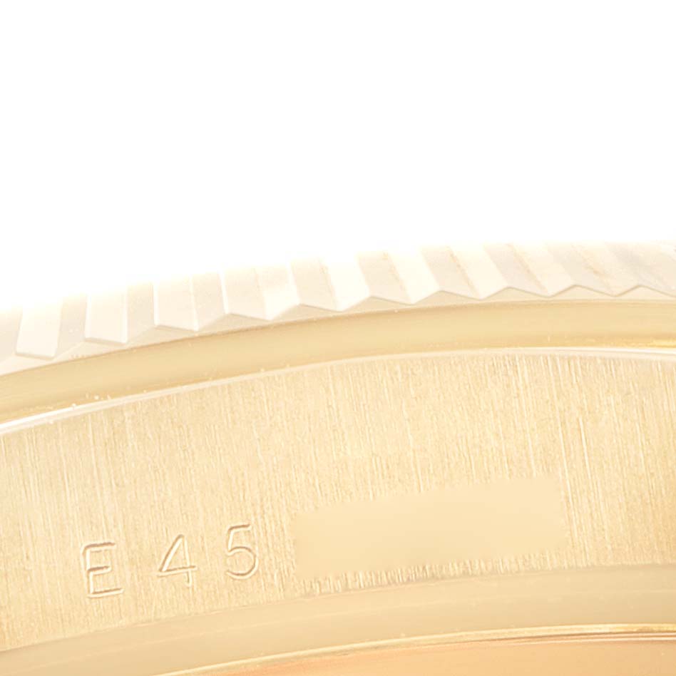 The image shows a close-up view of the fluted bezel and part of the engraved case back of the Rolex President 18238 Men's Yellow Gold Champagne Dial 18238 Men's Yellow Gold Champagne Dial model watch.