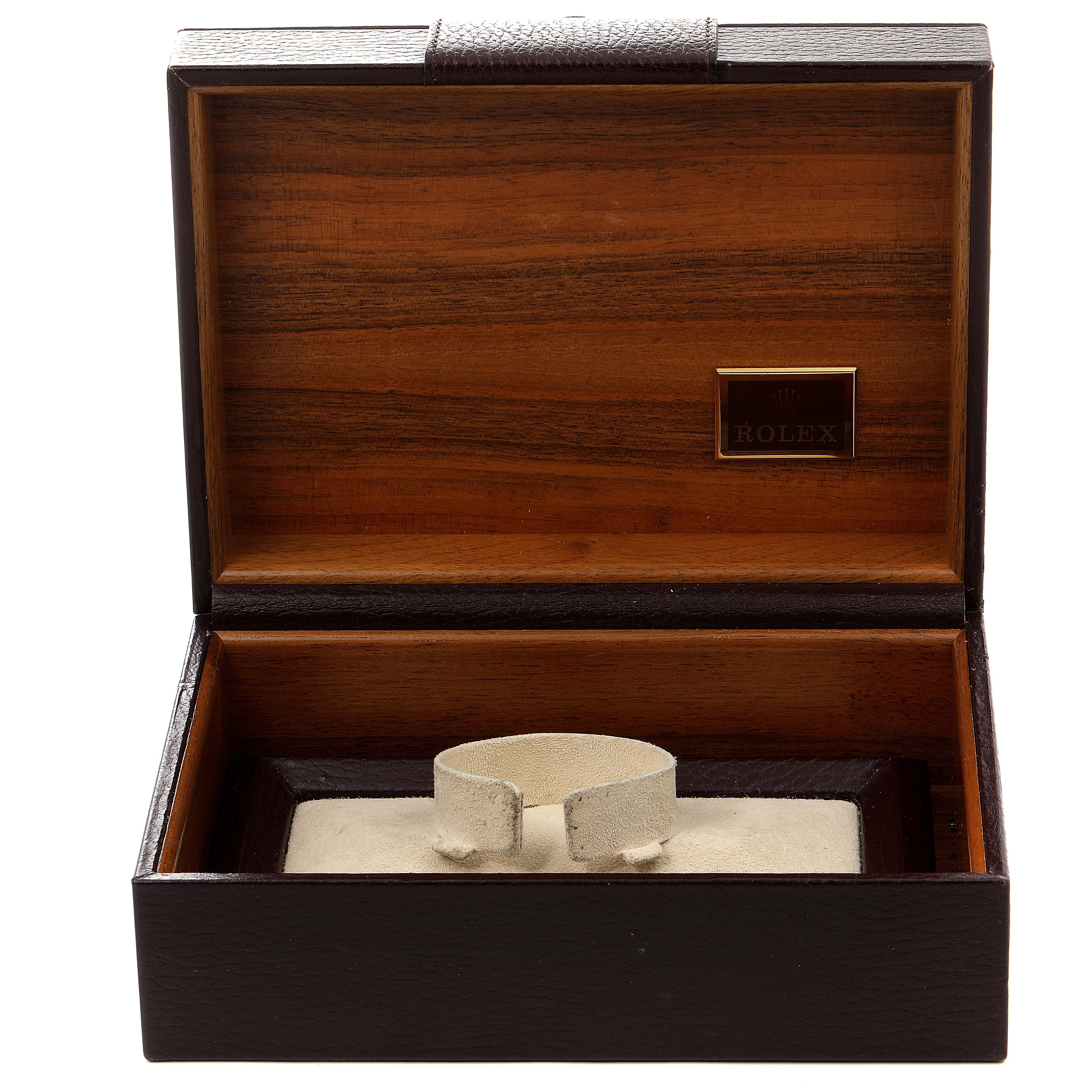 The image shows an open wooden box for a Rolex President 18238 Men
s Yellow Gold Champagne Dial 18238 Men
s Yellow Gold Champagne Dial model watch, displaying its interior with a cushion for the watch.