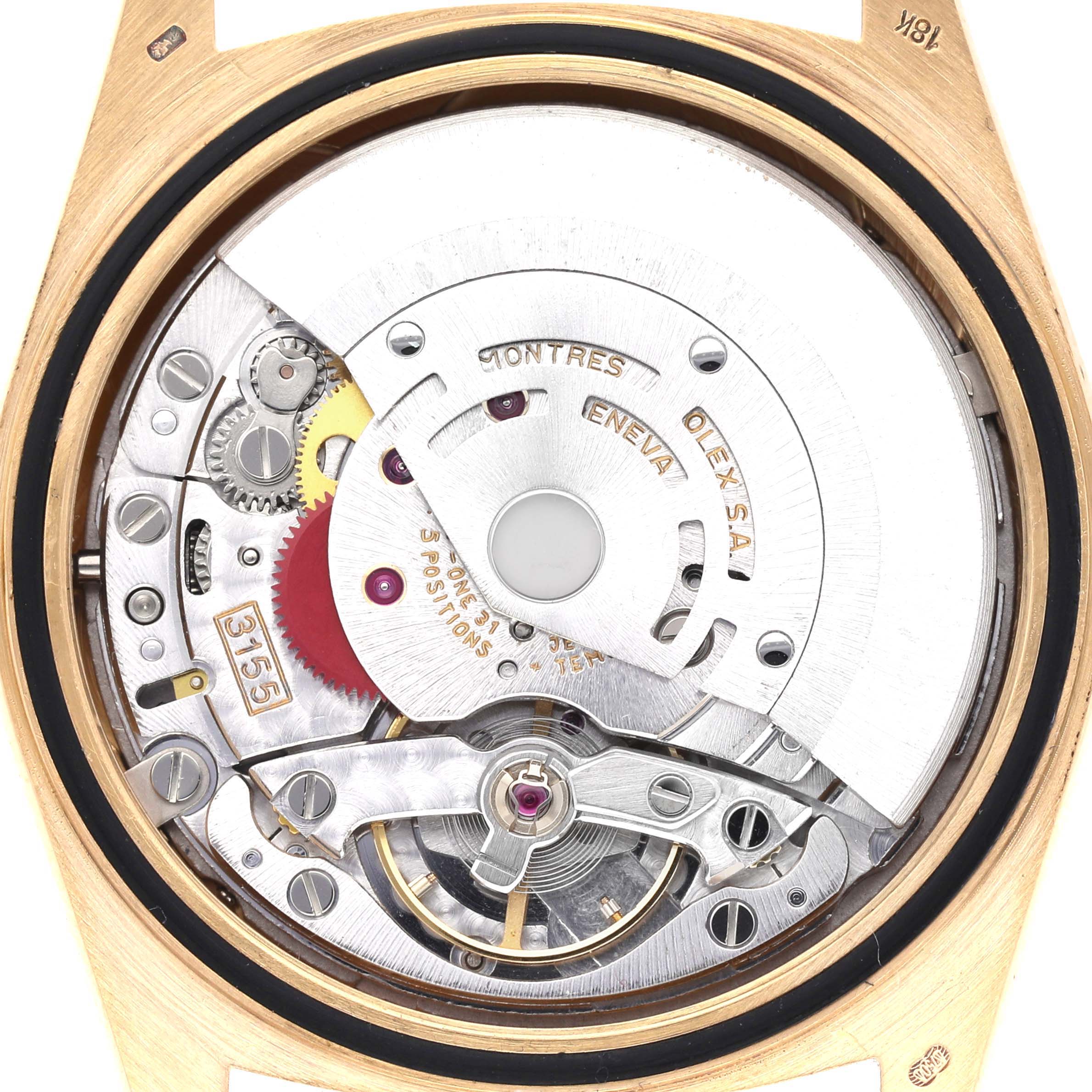 The image shows the movement of a Rolex President 18348 Men
s Yellow Gold Champagne Dial 18348 Men
s Yellow Gold Champagne Dial watch from the back, highlighting the intricate mechanical parts.