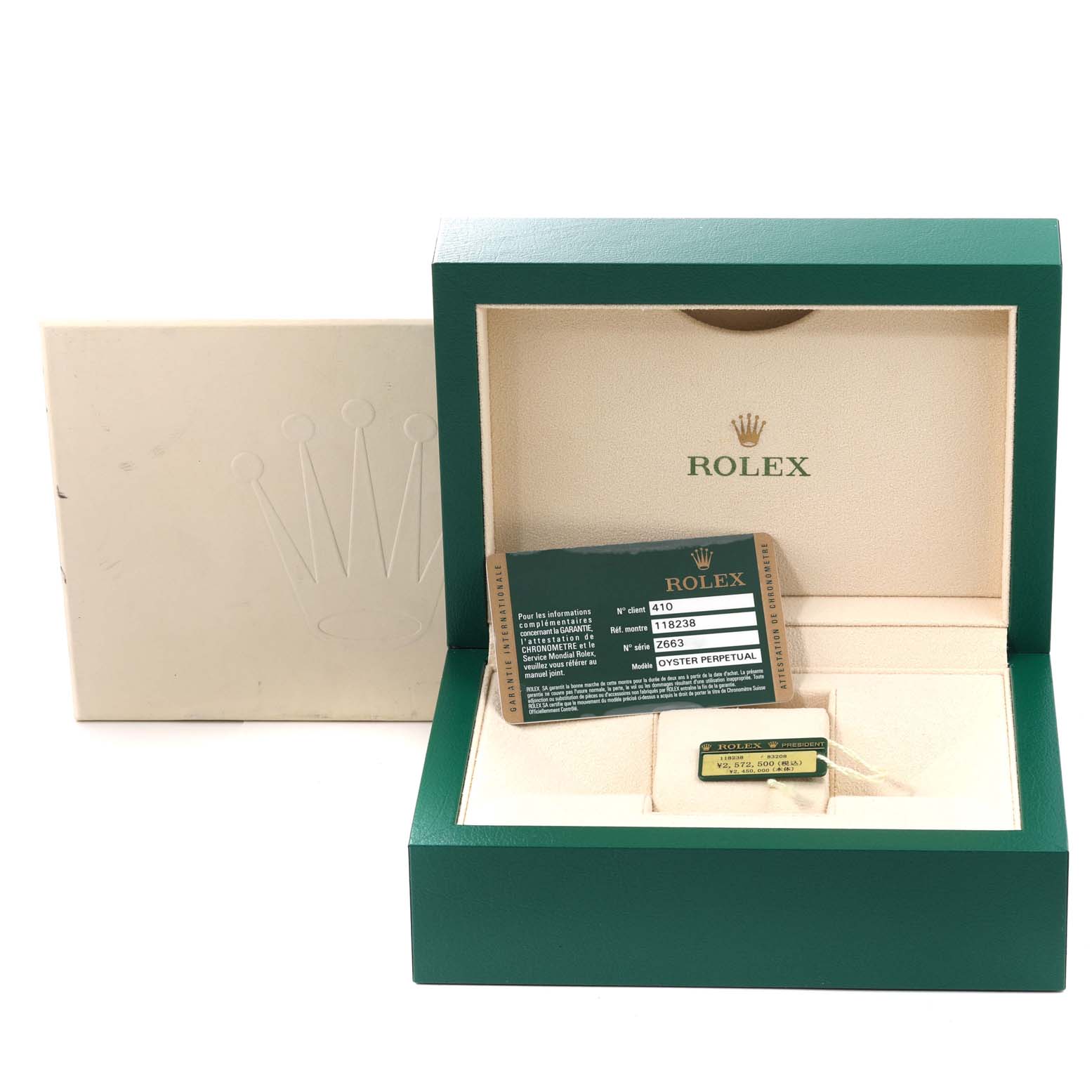 This image shows the open box of a Rolex President 118238 Men's Yellow Gold Green Dial 118238 Men's Yellow Gold Green Dial model watch, along with its identification card and tag.