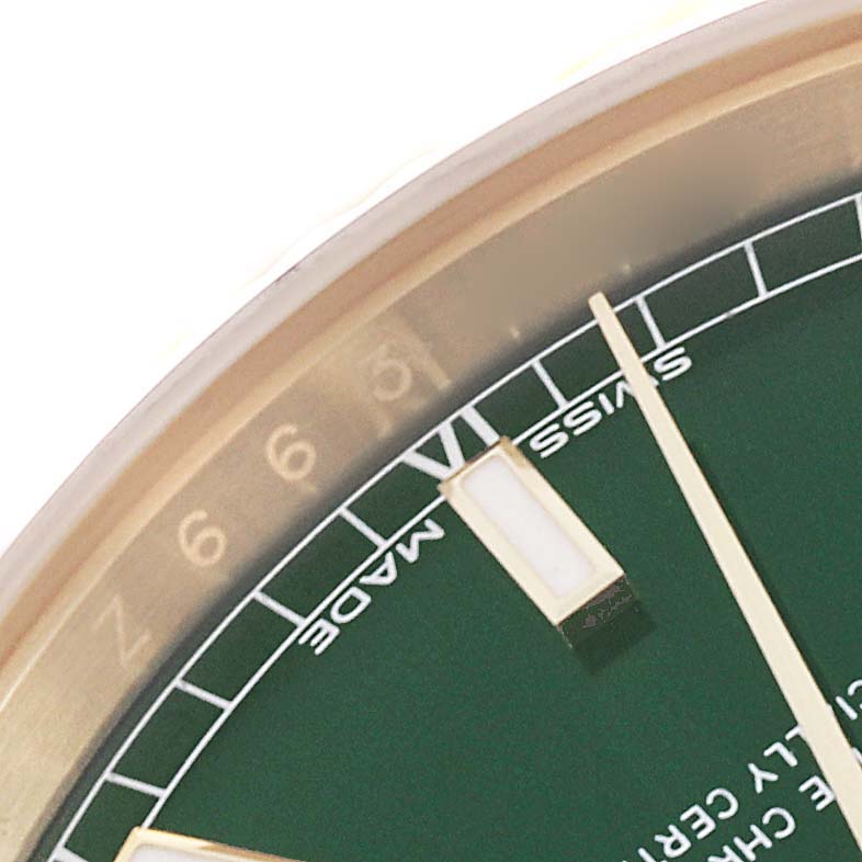 This image shows a close-up of the dial edge and hands of the Rolex President 118238 Men's Yellow Gold Green Dial 118238 Men's Yellow Gold Green Dial watch.